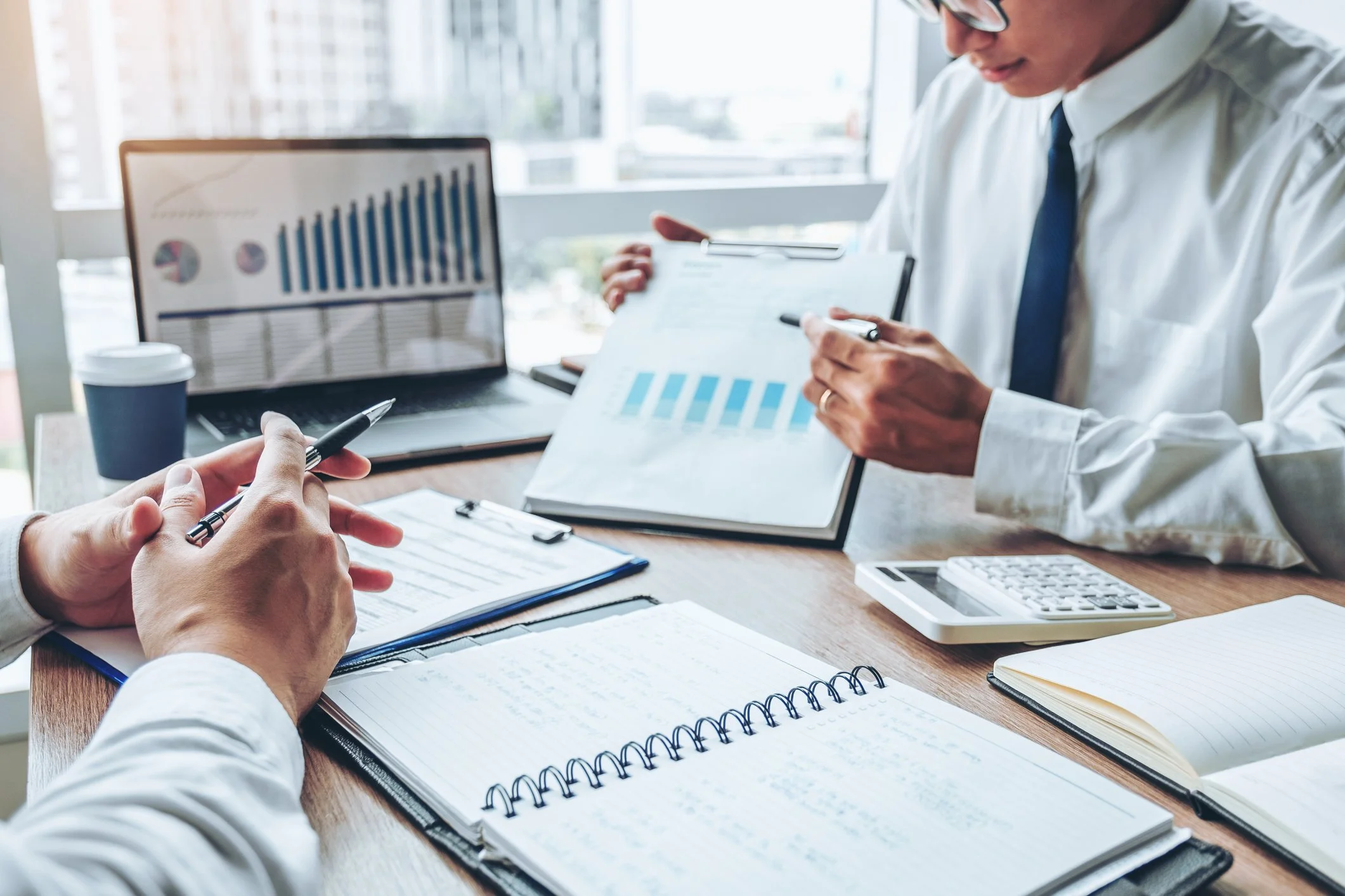 Image of business owner and advisor preparing for an acquisition