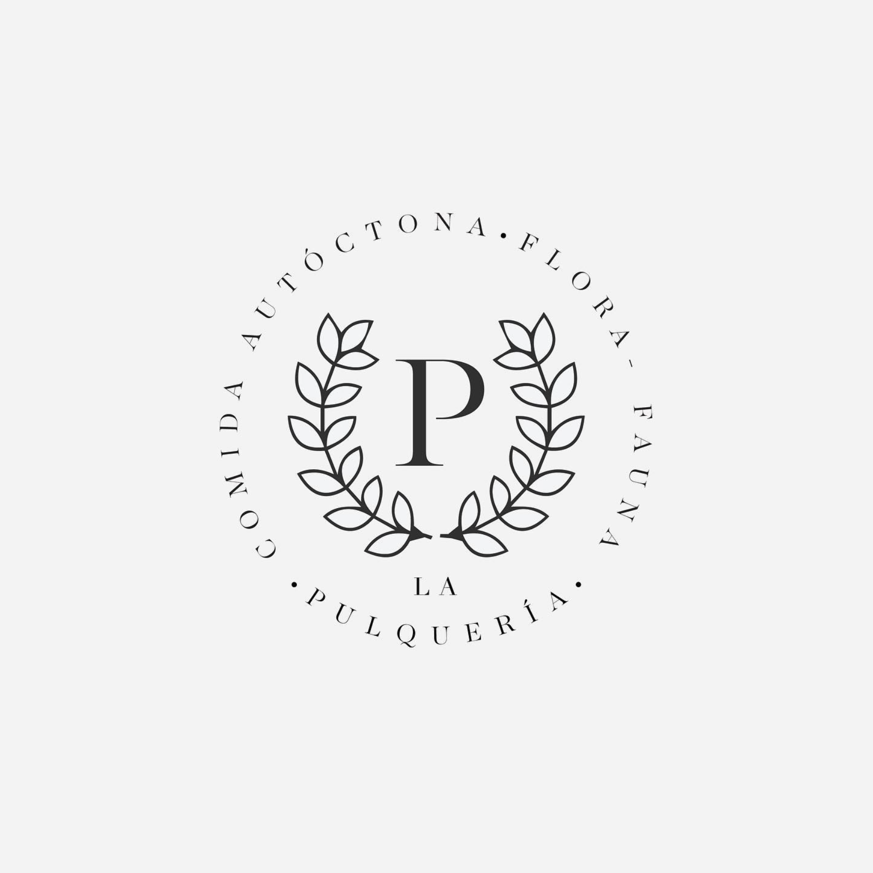 Black and white logo of a bakery or pastry shop with a letter P in the center, surrounded by a laurel wreath and a circular text reading "De Auténtica Florart La Puilquería"