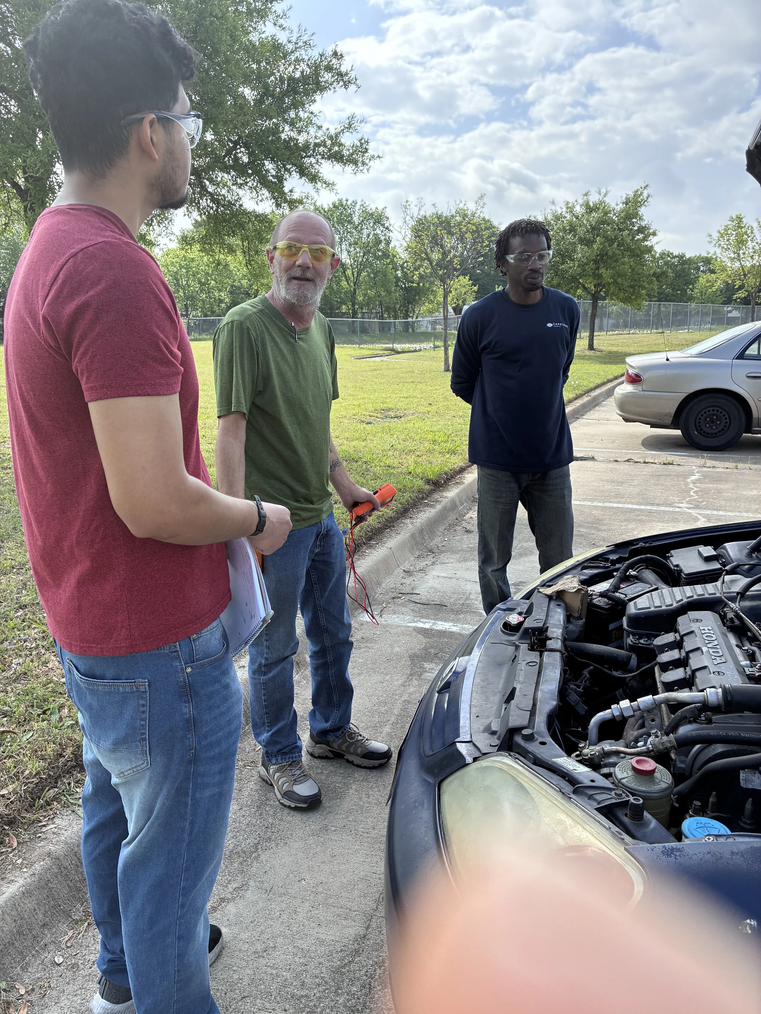 Four students on engine
