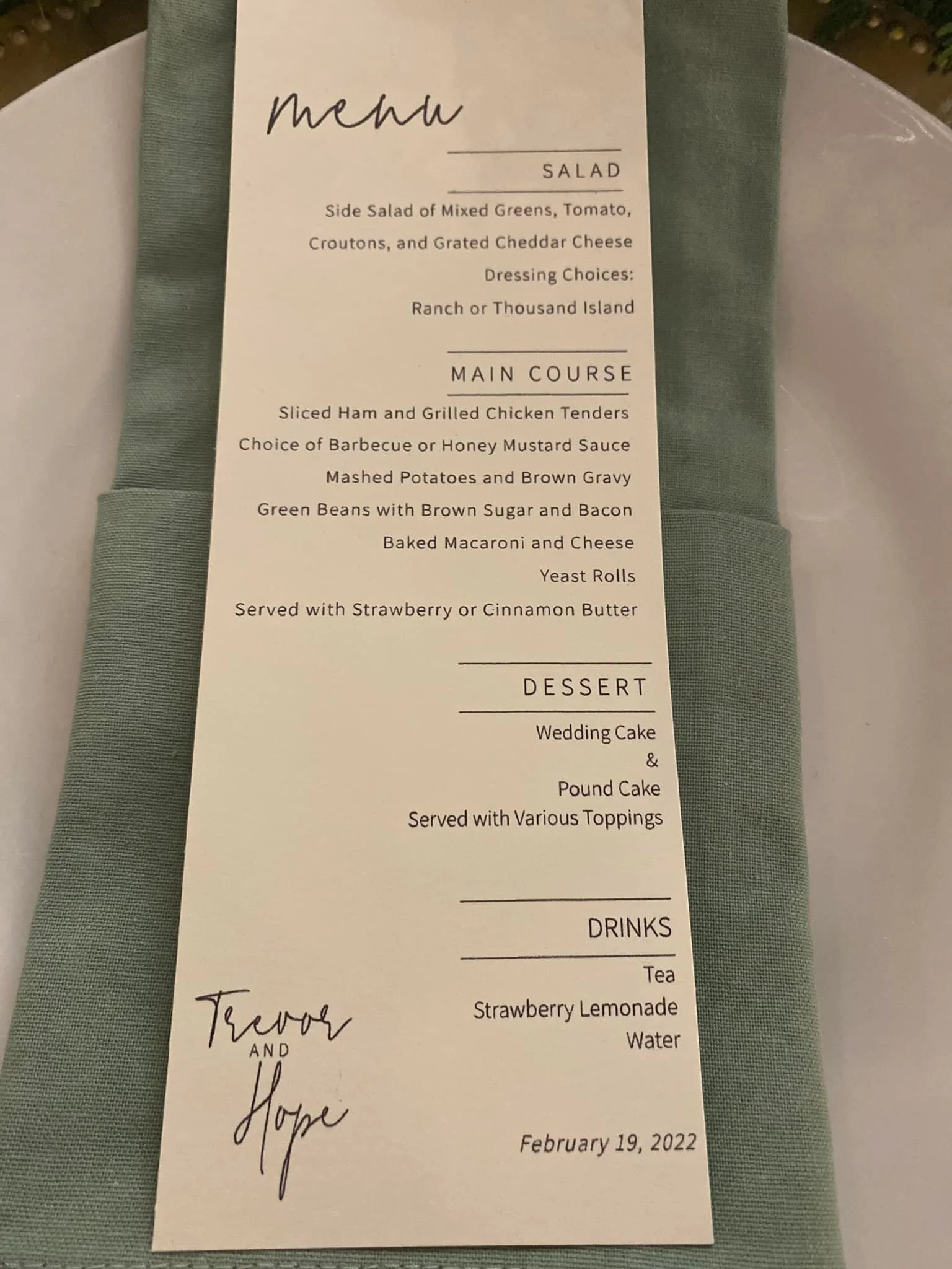 Wedding menu featuring salad, main course, dessert, and drinks, with the names Trevor and Hope and the date February 19, 2022.