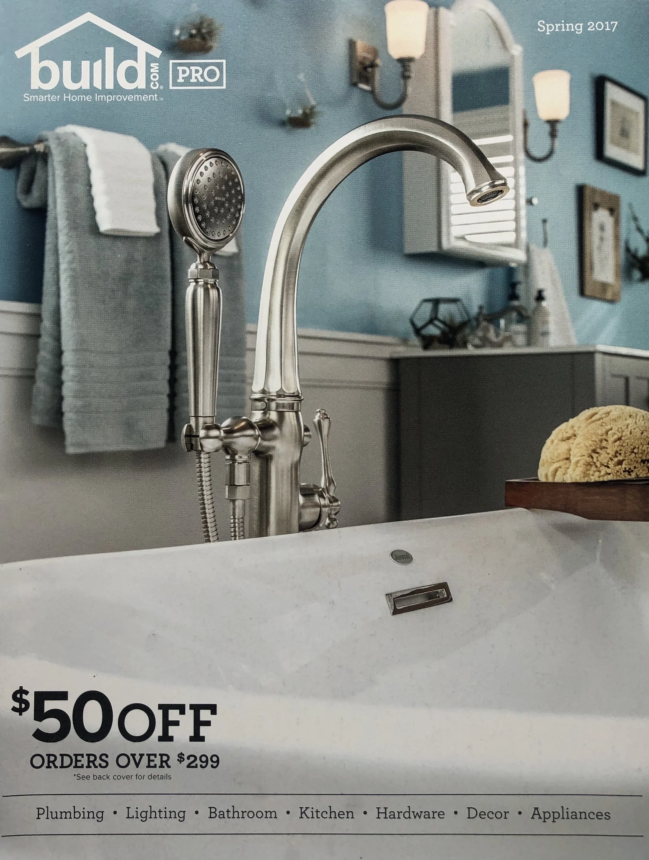 A promotional flyer for build.com Pro offers $50 off on orders over $299. The flyer features a kitchen sink with a modern brushed nickel faucet and handheld showerhead, and a bathroom vanity with a large mirror and wall-mounted lights. The bottom of 