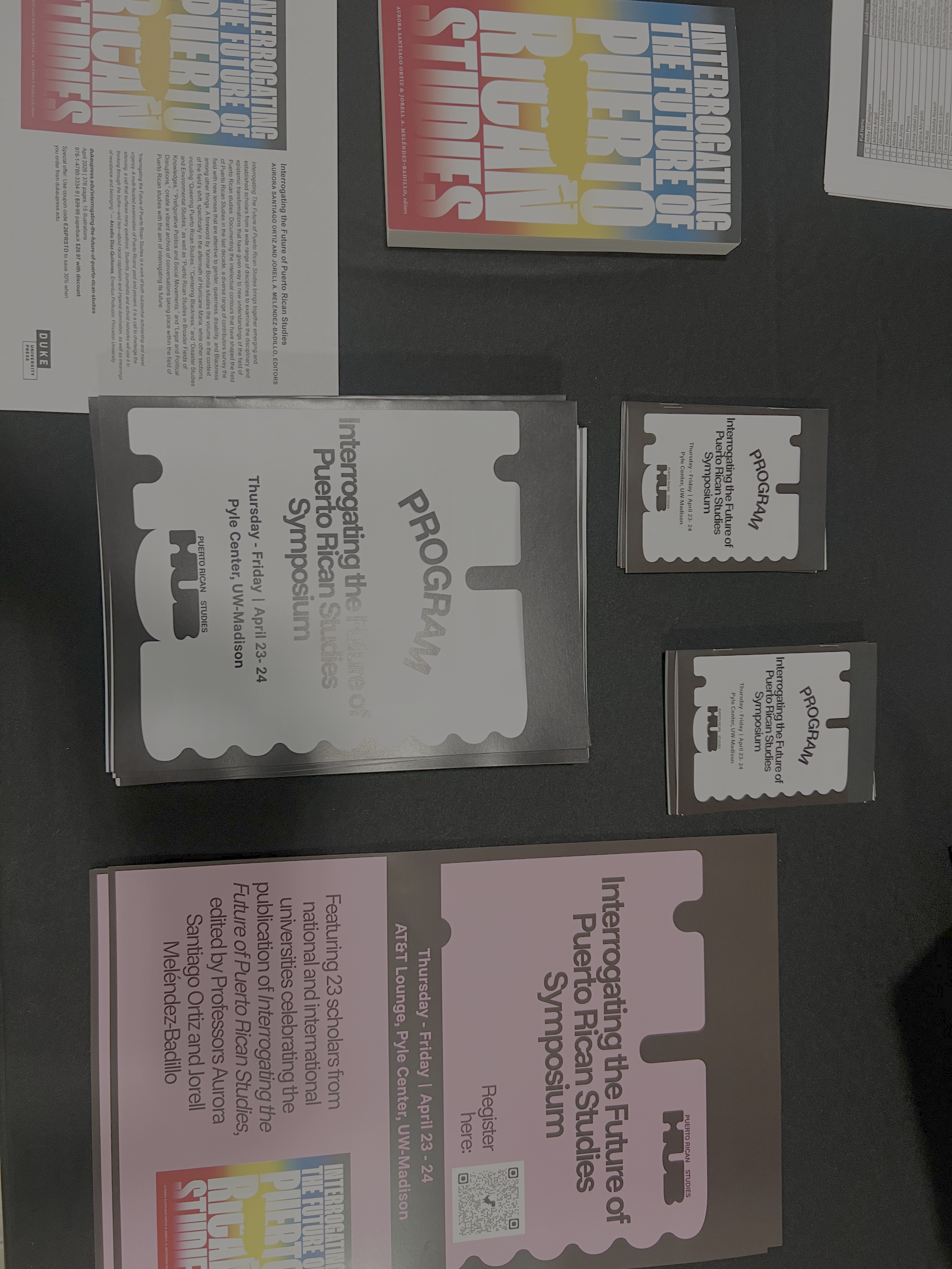 Flyers alongside the Interrogating the Future of Puerto Rican Studies book.