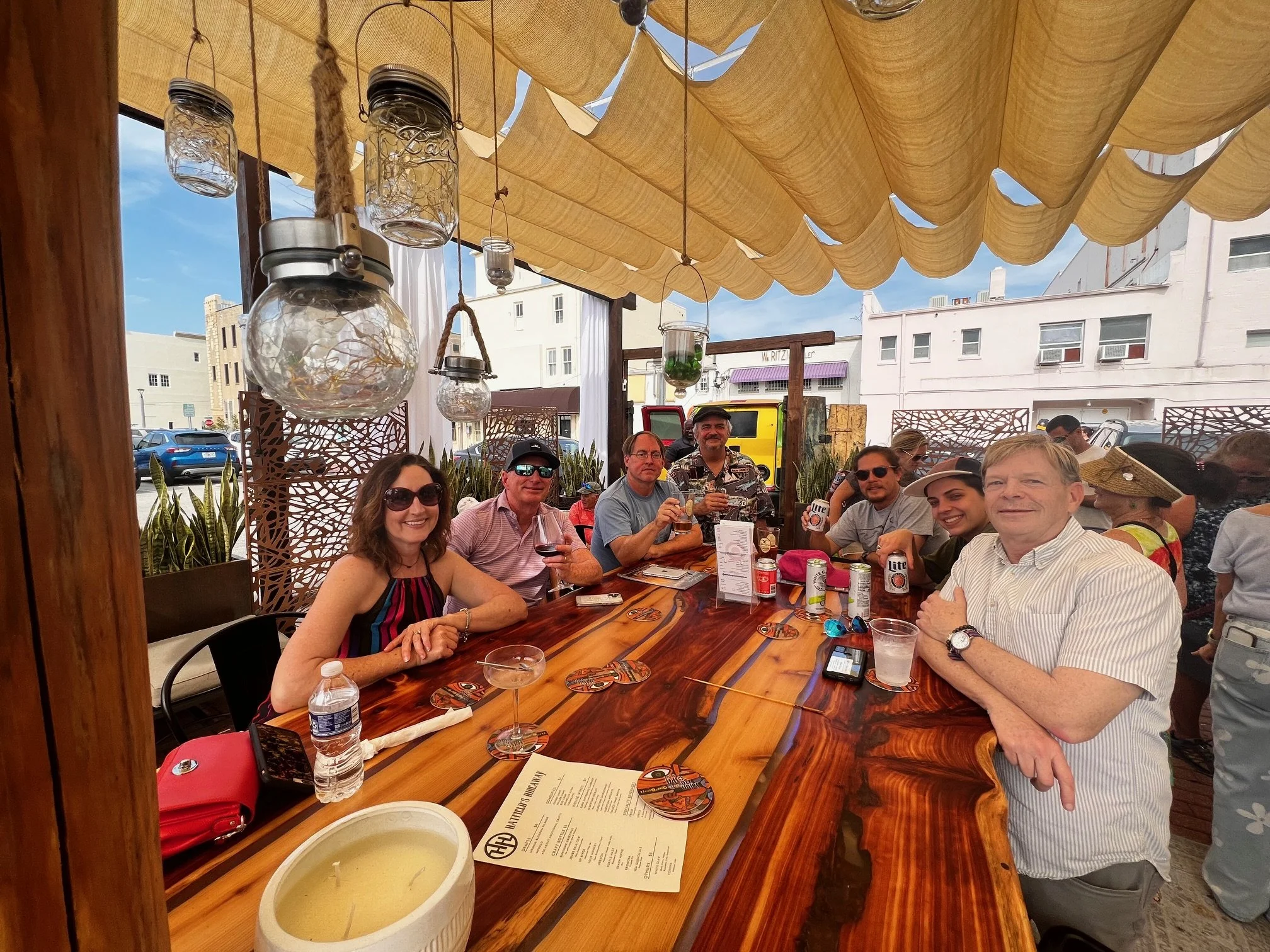 Parties of people enjoying beer and wine on the Patio at Hatfield's Hideaway