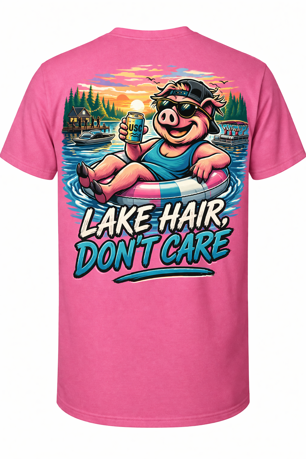 Pink T-shirt with a cartoon pig wearing sunglasses, a cap, and a tank top, floating in a lake on a pool float, holding a can of soda. The background shows a sunset over a lake with trees, boats, and a dock, and the text 'Lake Hair, Don't Care' at the bottom.