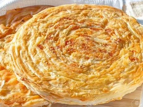 Layered flatbread with onions.