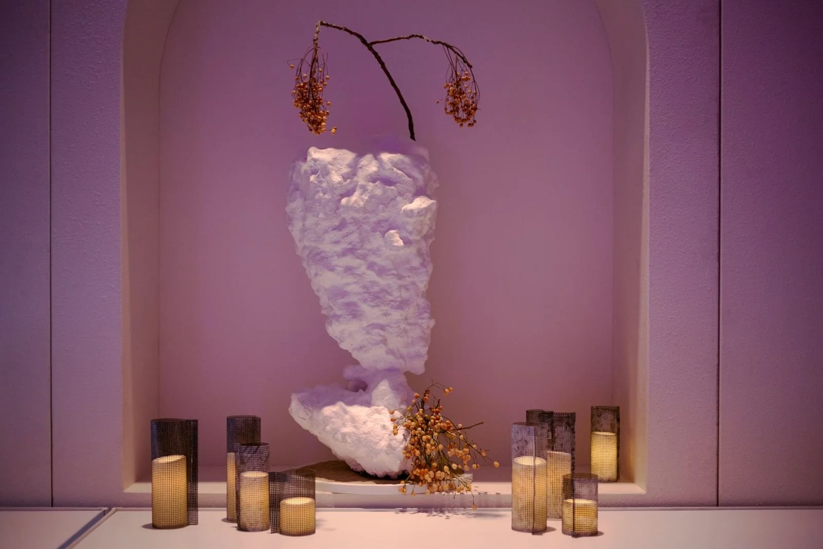 sculpted vessel with LED candle sleeves