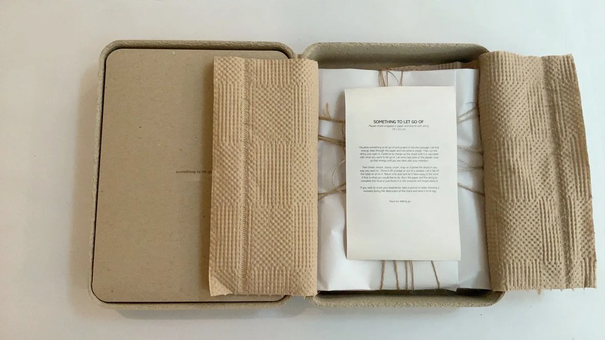 Ritual Letting Go tablet by Kept LA open in sustainable recycled  cardboard packaging with corrugated insert and printed instruction  card, top view