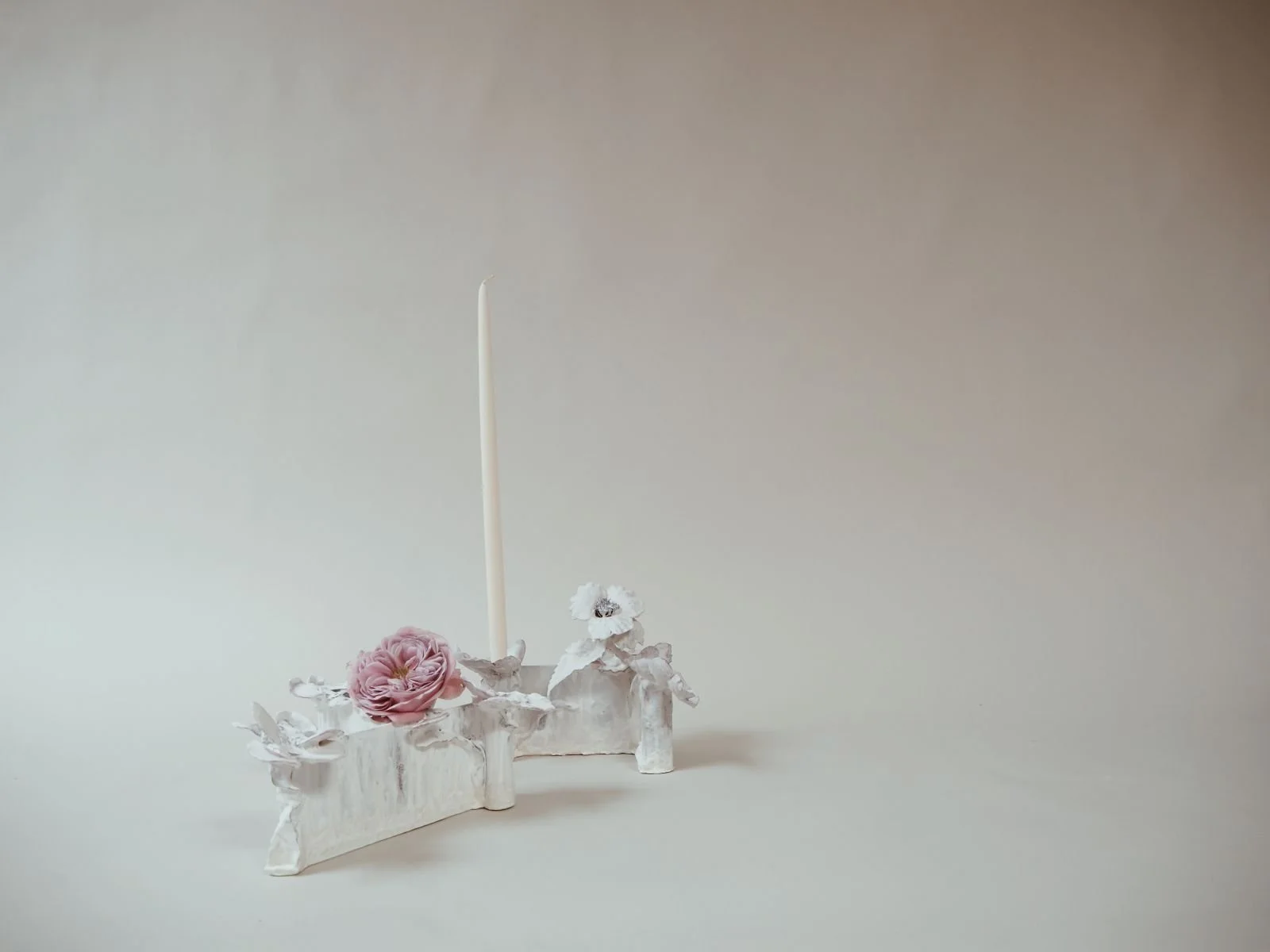 Tole Candelabra Vessels by Kept LA with white taper candle  and fresh pink peony in glass flower tube, showing candelabra  and flower vessel used together