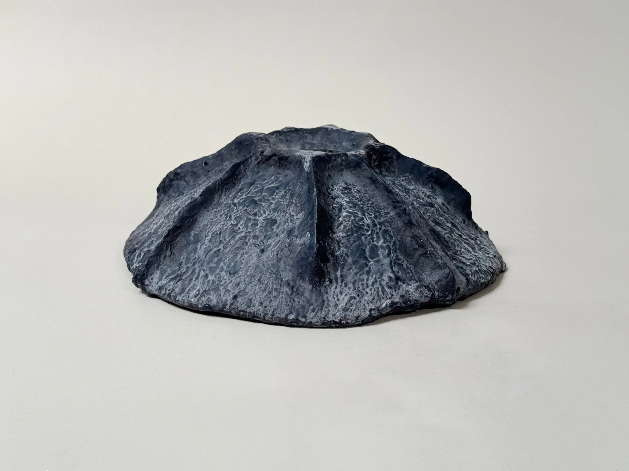 Close detail of Midnight Bowl by Kept LA — hand-sculpted paper  mache and gypsum bowl in dark midnight pigment