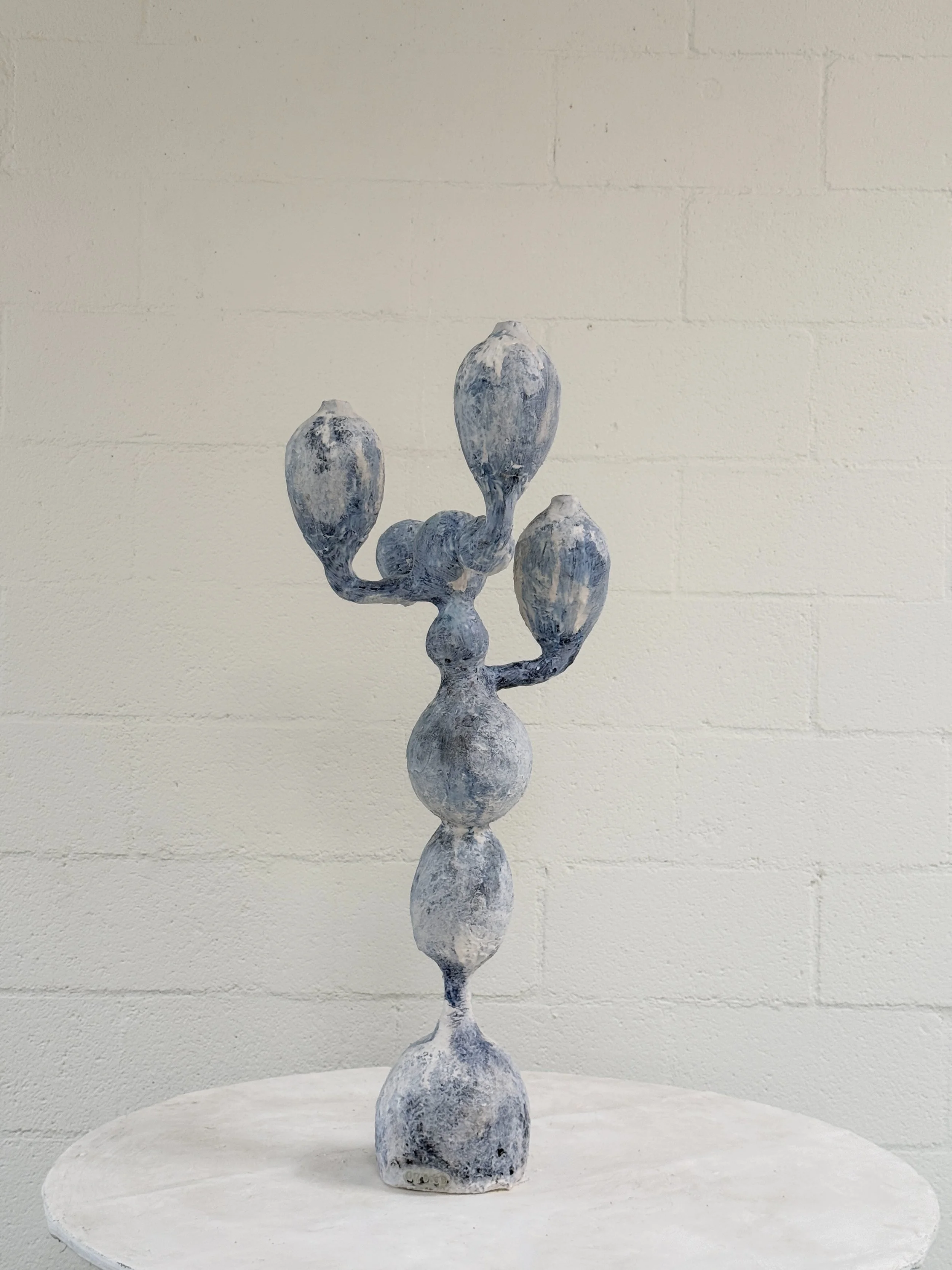 26022-Kept-LA-candelabra-hand-sculpted-against-brick.JPG