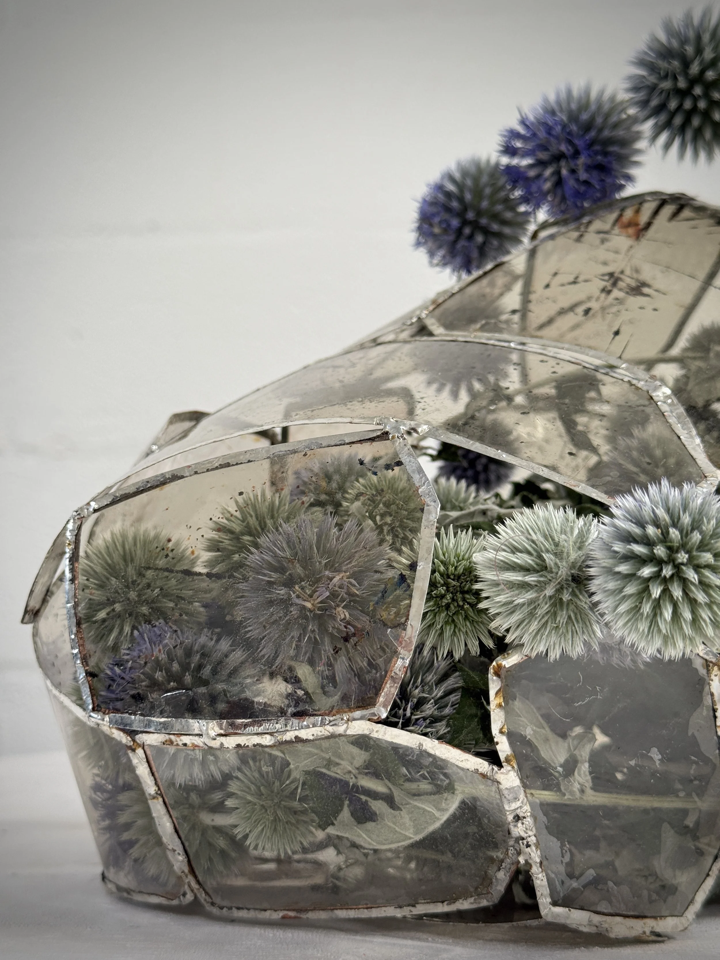 Hand soldered natural Mica vessel with blue thistle.