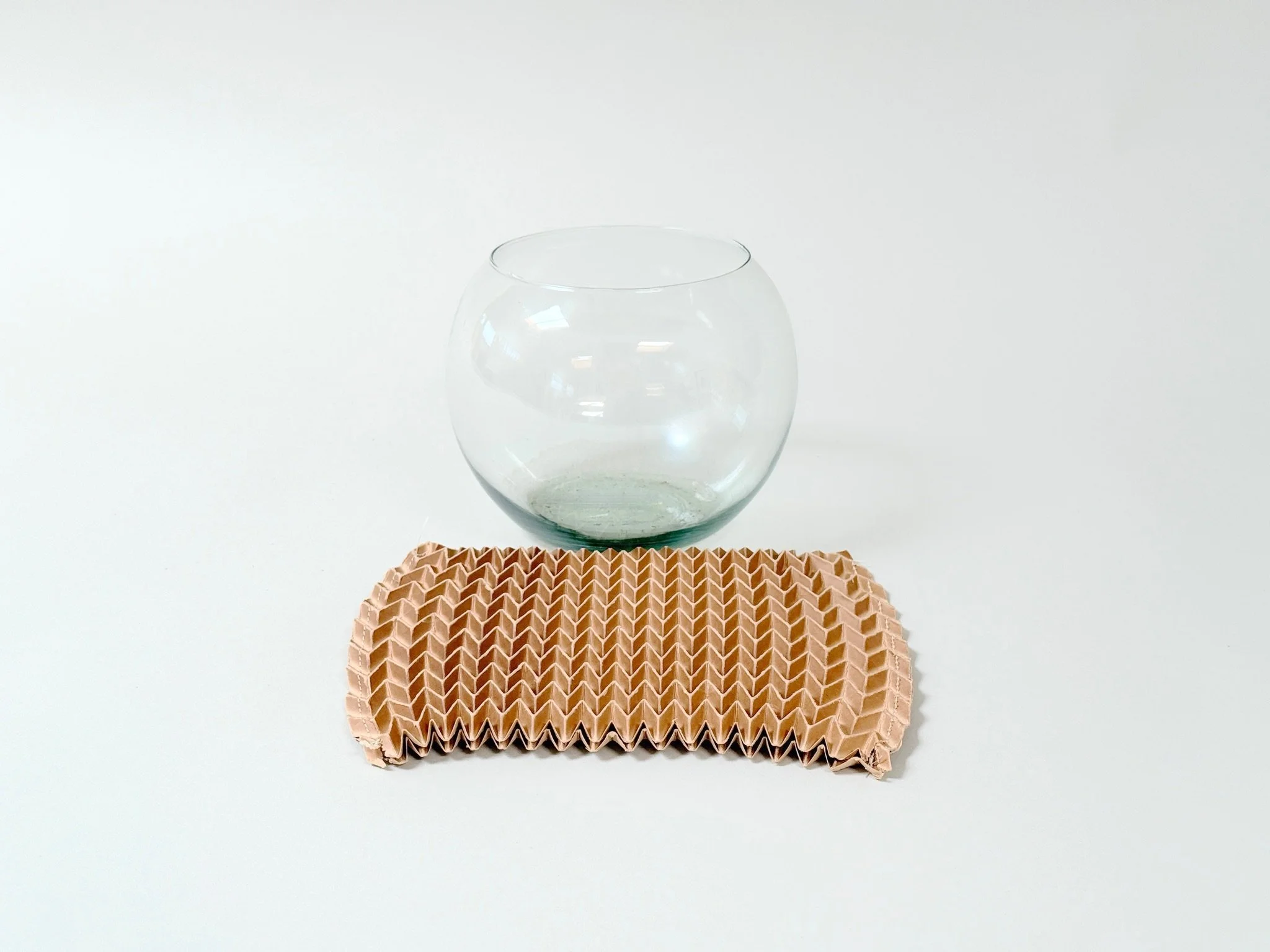 Pleated Paper Vase Sleeve by Kept LA shown with vase exposed to see how it works