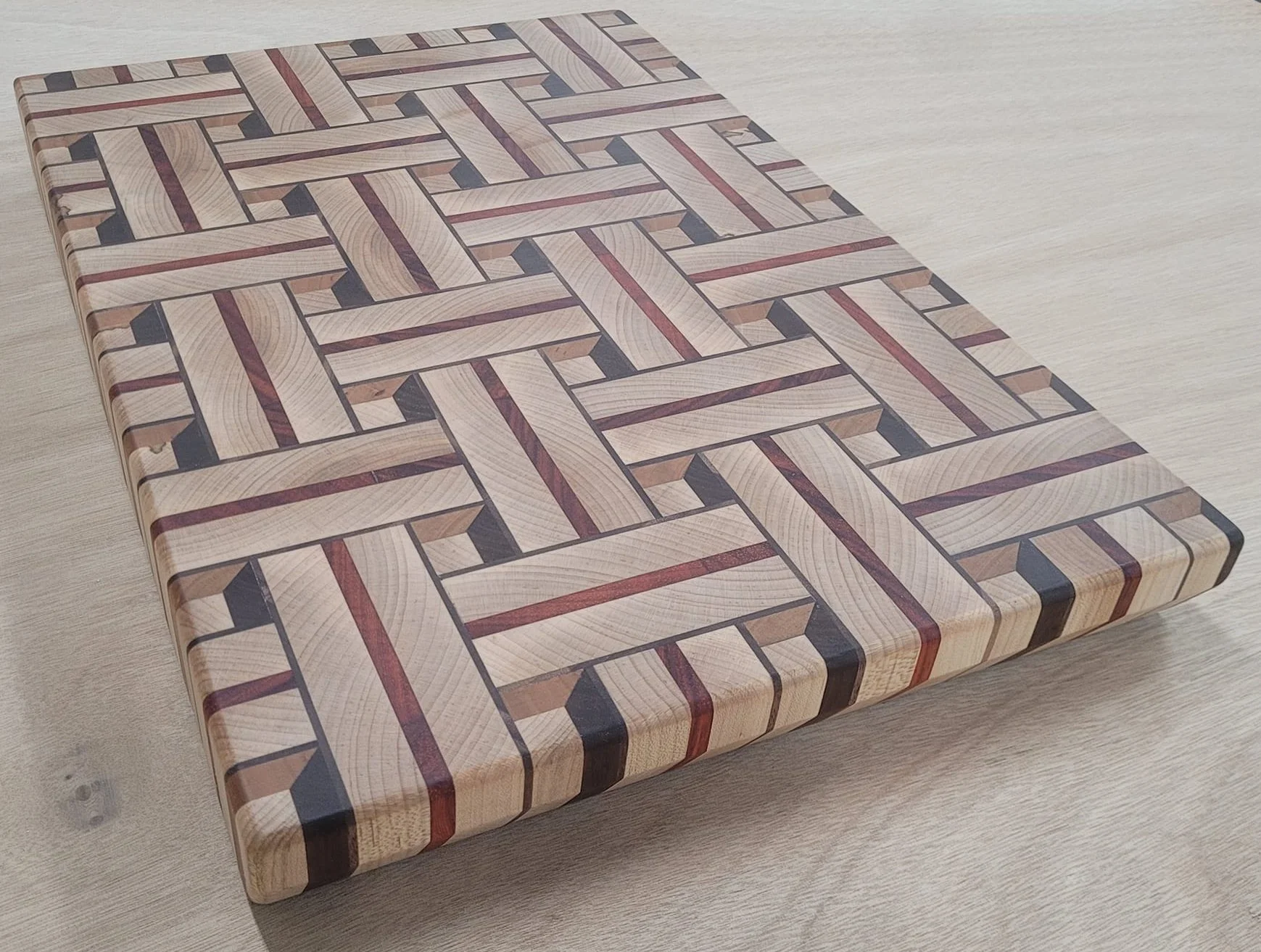 "3D Basket Weave" board is made from maple, padauk, walnut and cherry