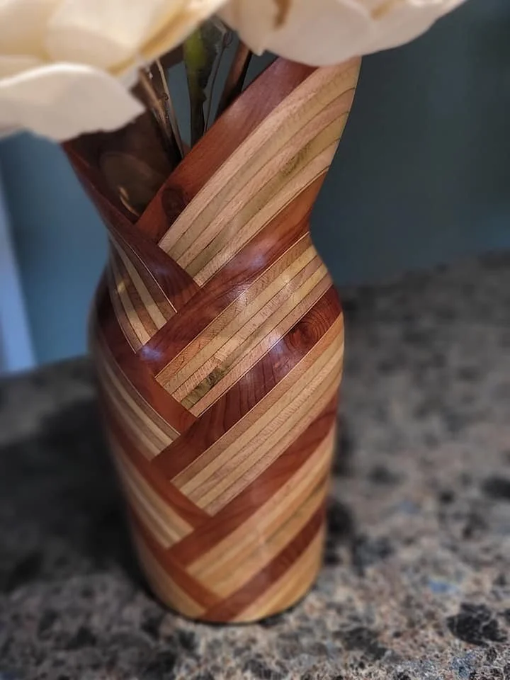 Plywood can actually look pretty good in a turned project. With the angles it creates a neat "morph" effect as the vase flares towards the top.
