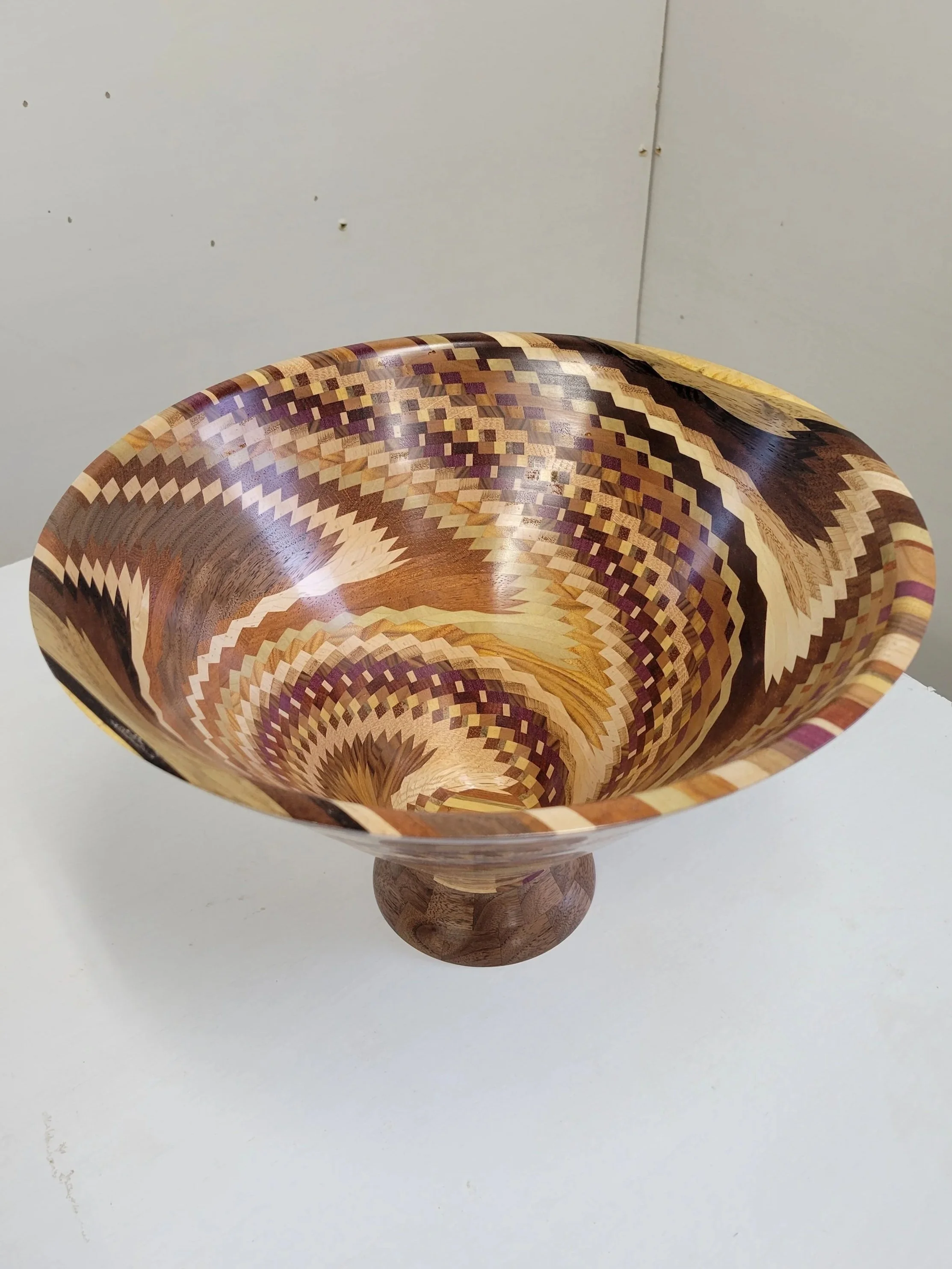 "Pixel Drift"
Dizzy bowl made of multiple species of wood including Wenge, purple heart, bloodwood, jatoba and many others. Click on the image to see a video of it. 