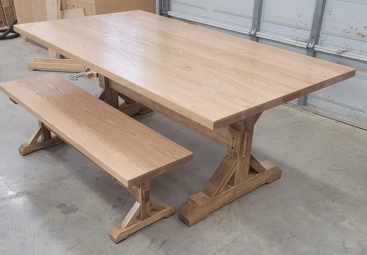 Farmhouse dining table and bench. The top is made from oak and the base is poplar (stained). 