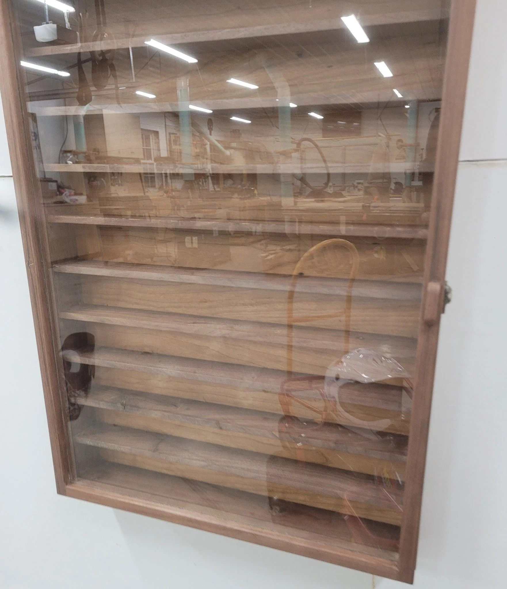 Display case with glass door. Show off all of your knick-knacks and chachkies. 
Walnut with cherry plywood for the back.