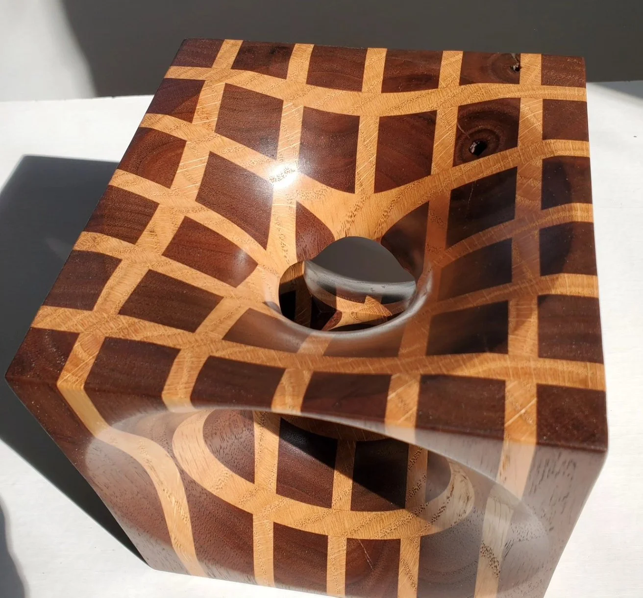 Handmade walnut and red oak cube vase.