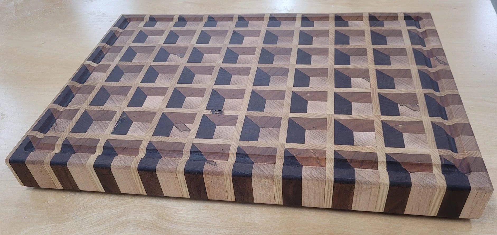 Endgrain 3D illusion cutting board. Maple, cherry, walnut, and ash.