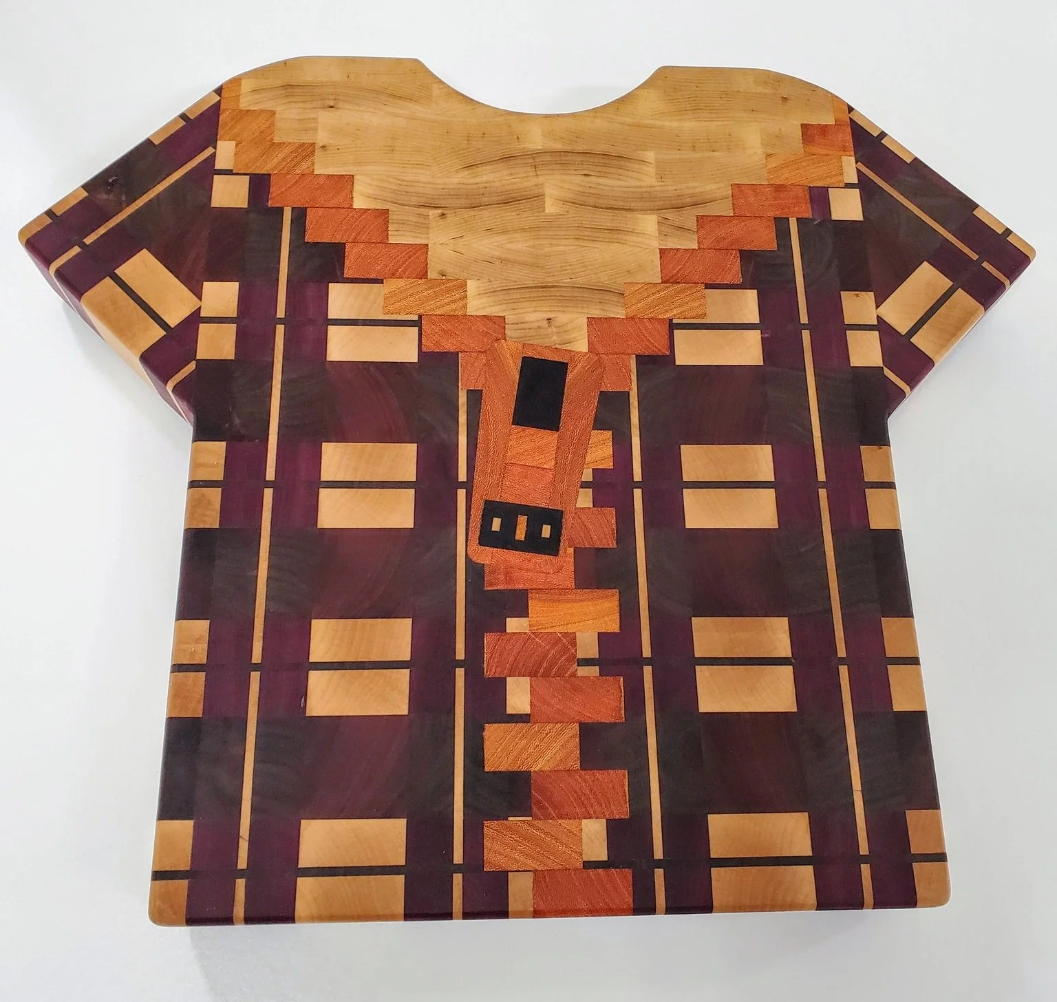 'Plaid Dad'. All endgrain and finished with my own wax+oil blend. 
Maple, sapele, walnut, osage orange, ash, purple heart, and wenge.