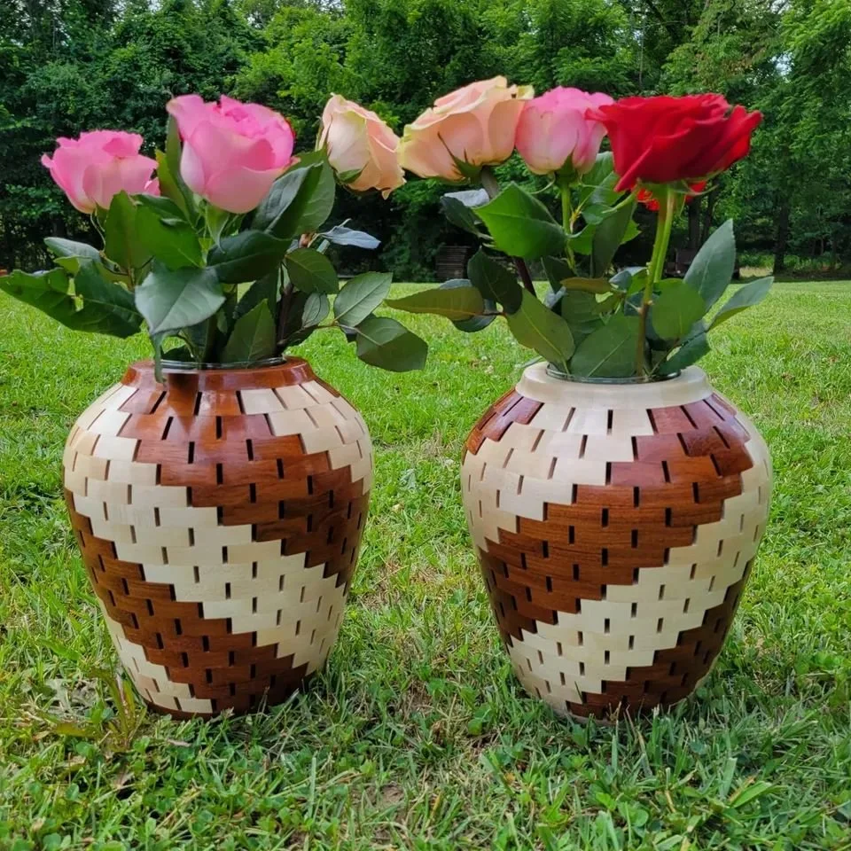 Twisted Vases.

Each vase has 325 individual pieces. Maple and Jatoba wood.
