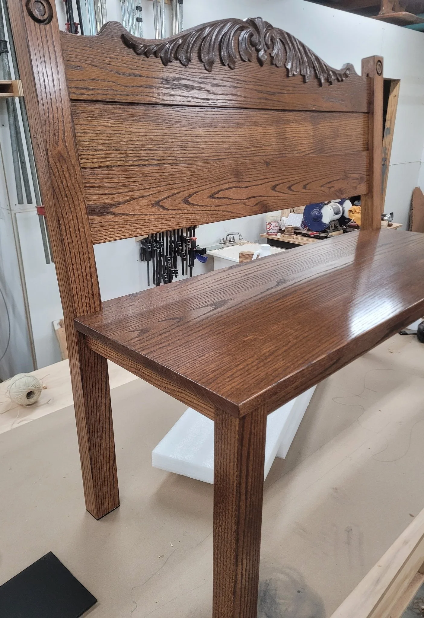 (After)
An oak heirloom headboard that I was able to turn into a bench. 
I used all the original wood that I could out of the headboard but had to add a few more boards to complete the design. I was able to match the stain by mixing a couple differen