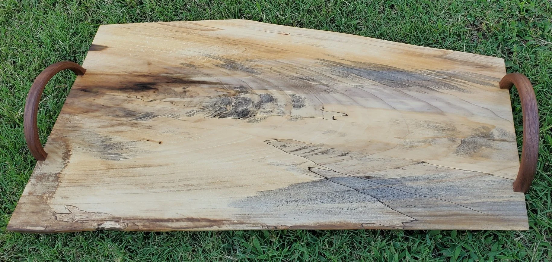 Live edge poplar slab serving tray/charcuterie board. Some cool character in this piece of wood, blue staining and a little spalting. Bent walnut handles.