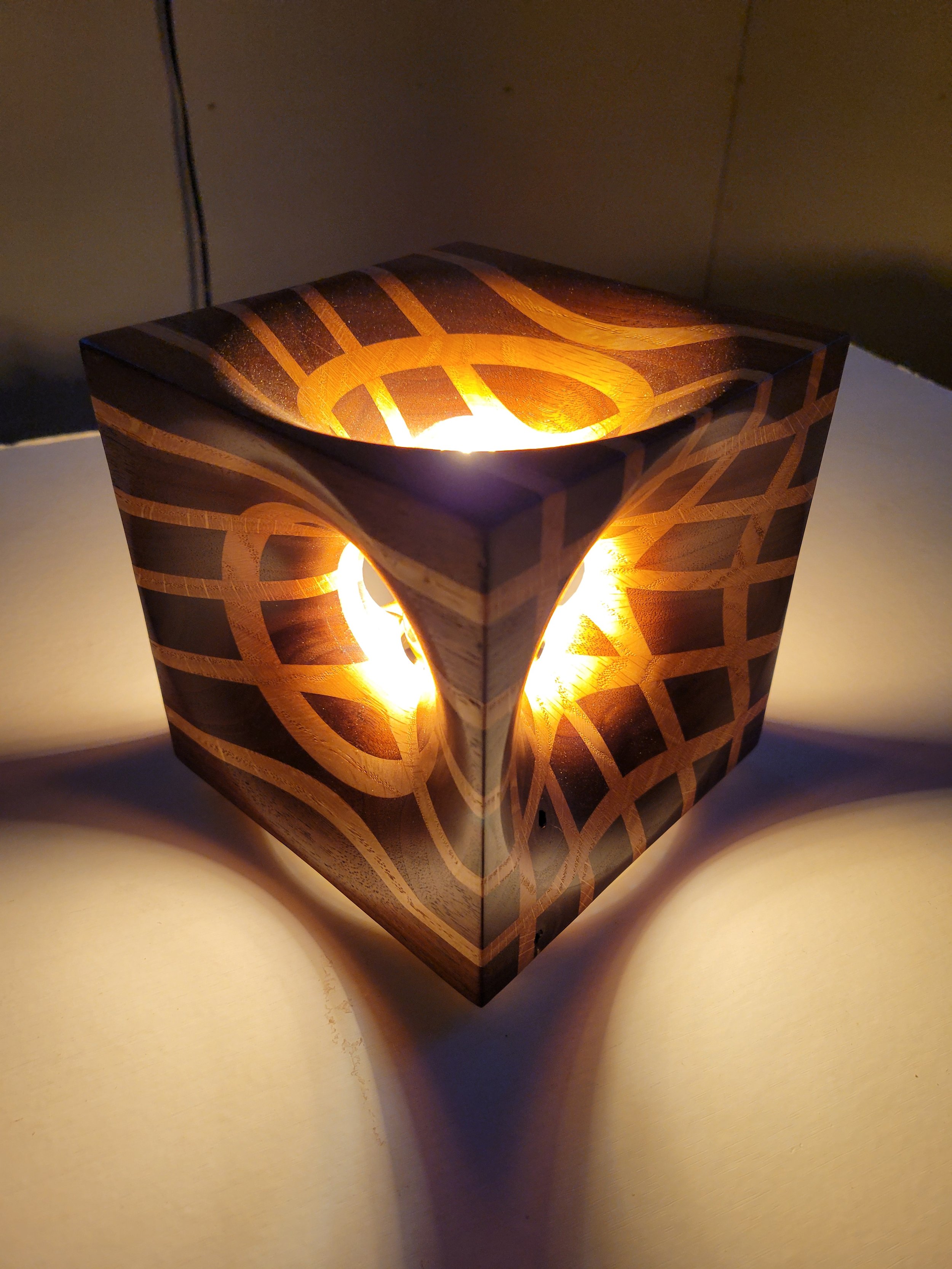 Turned this cube vase into a lamp. Walnut.and oak.