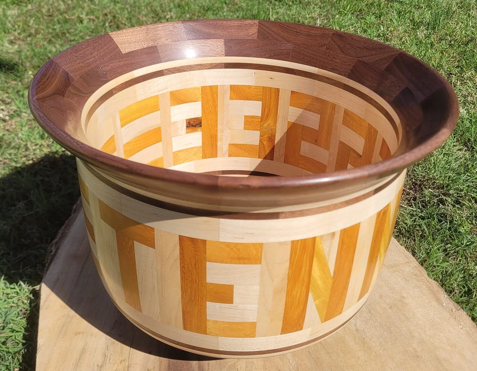 The wood is walnut, maple and osage orange for Tennessee. 
