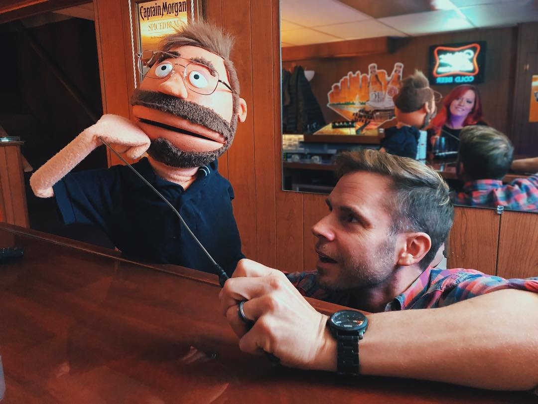 Curt Wootton practicing with a Pittsburgh Dad puppet.