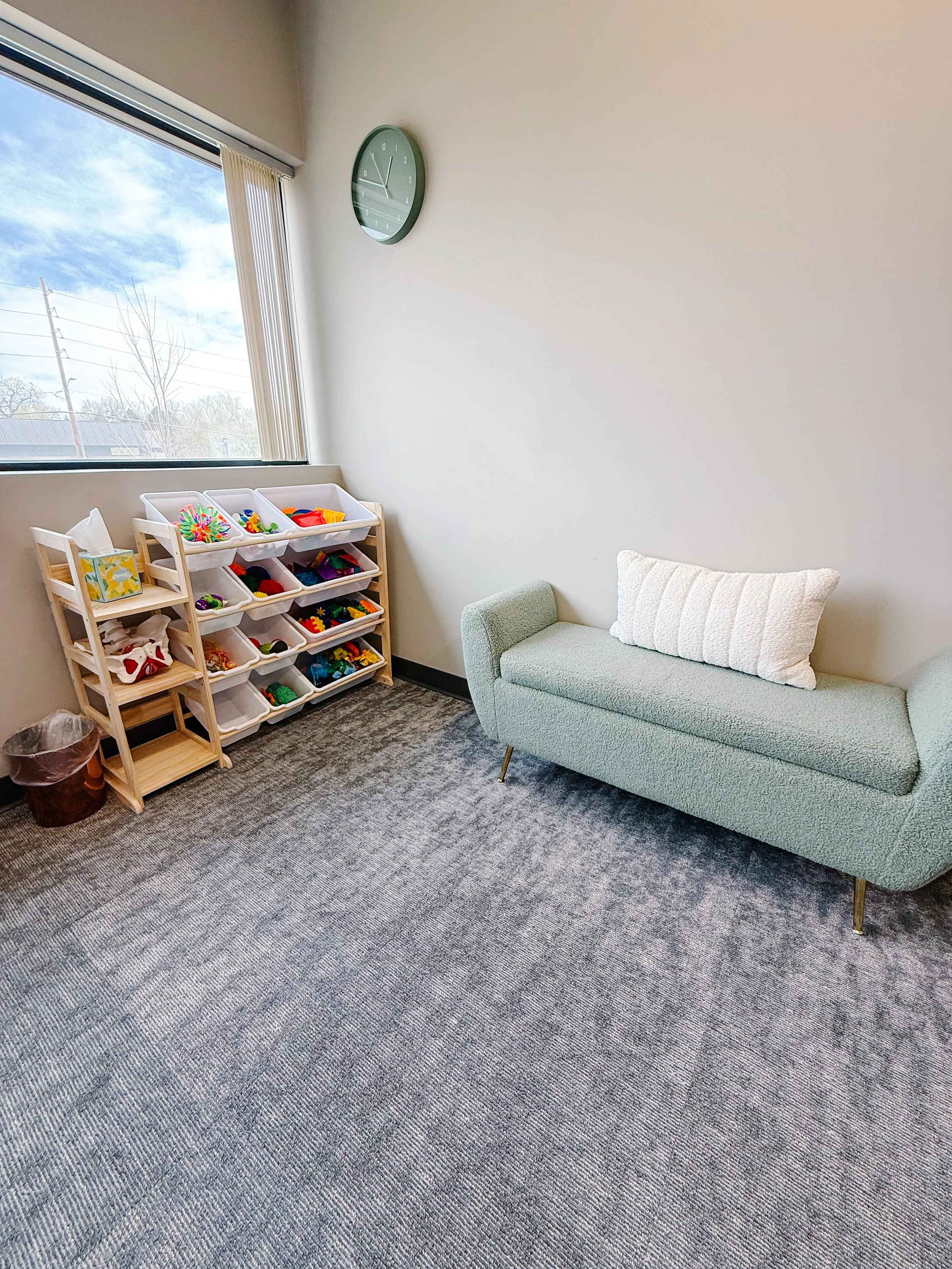 therapy treatment room, kids toys and bench
