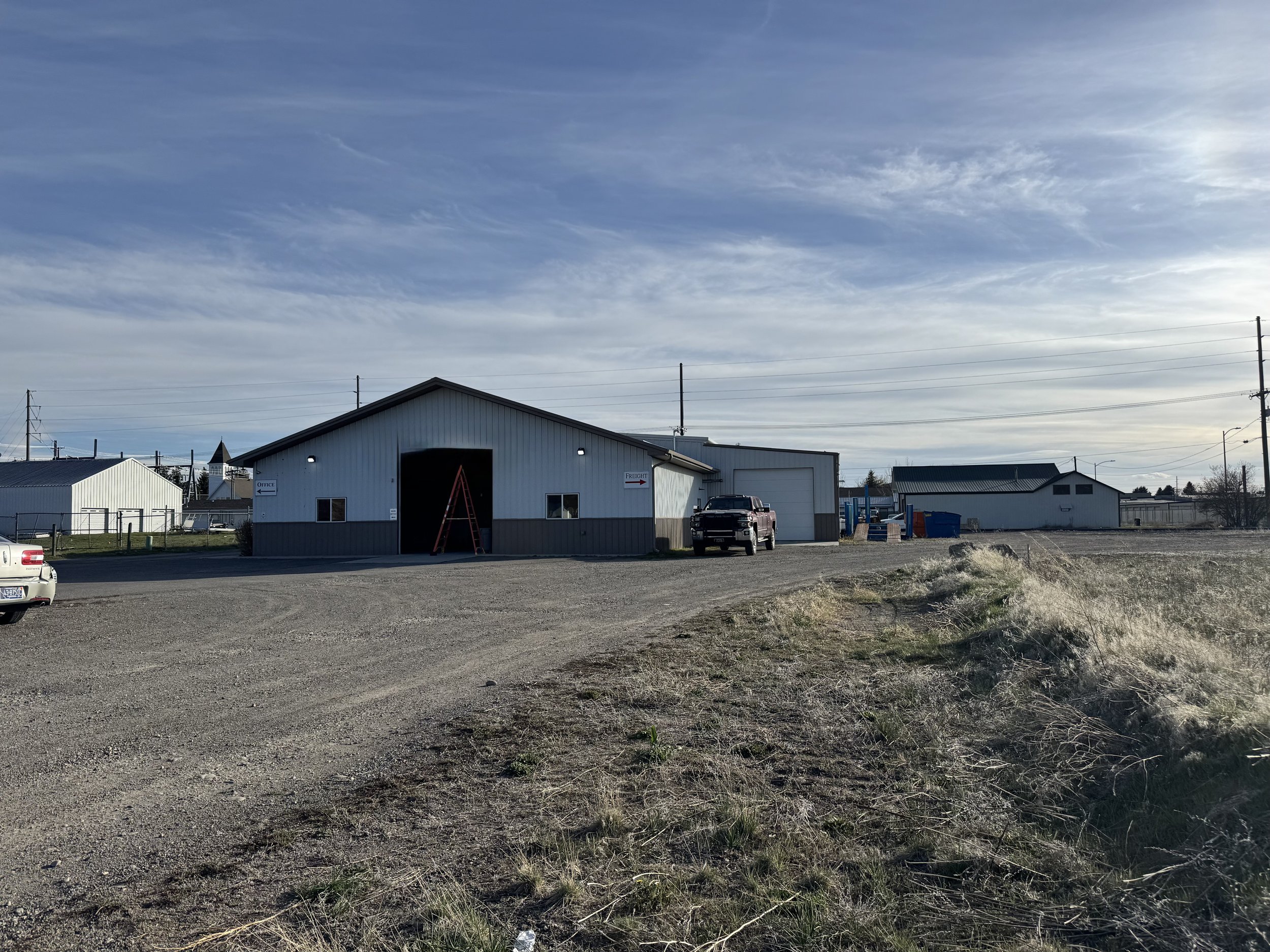 Image of a building on a dirt lot