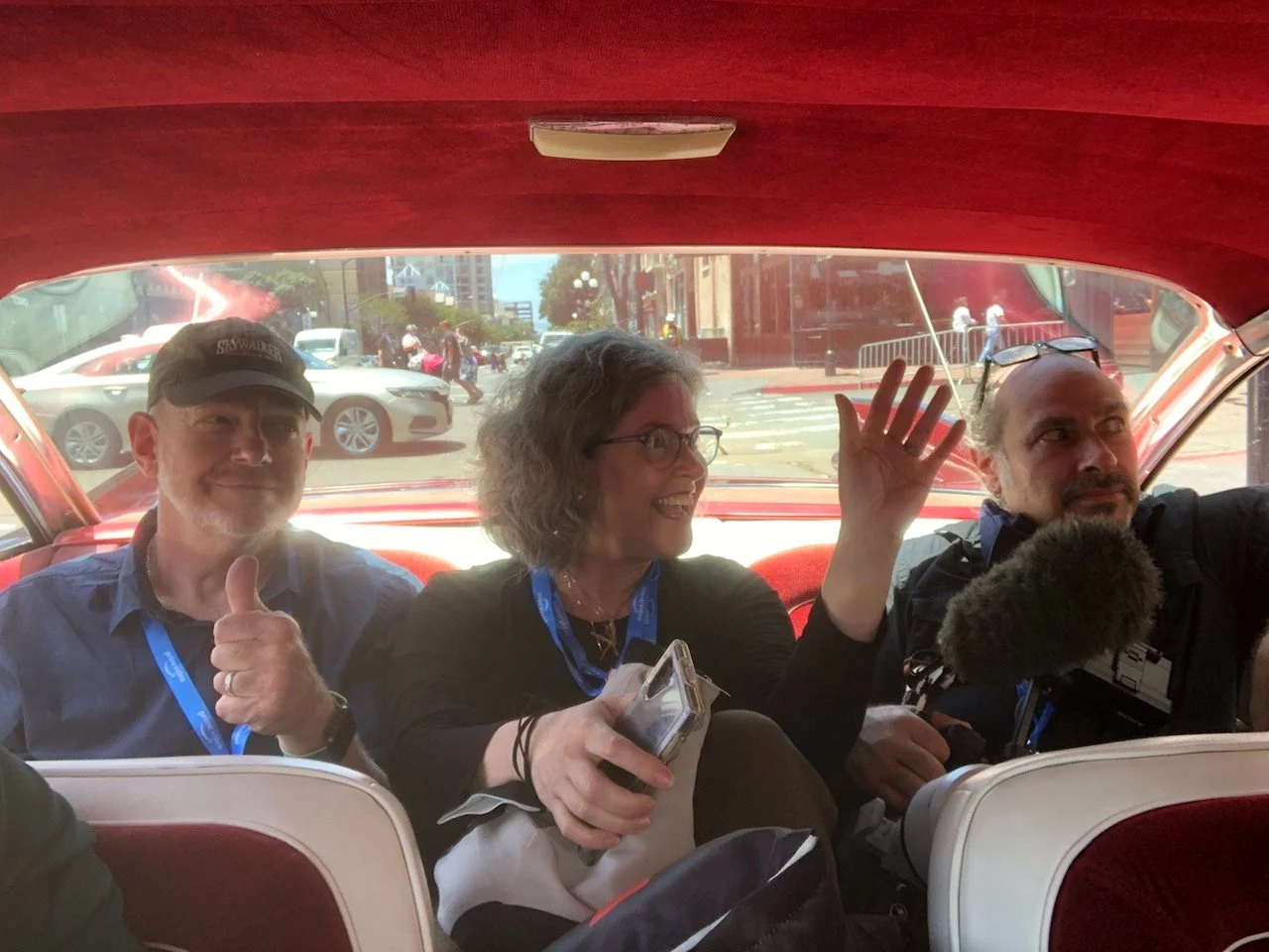 Favorite crew friends and collaborators Phil, Kerry, and Robert being driven in style in the Legion M car.