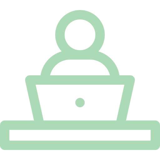 Icono de una persona frente a una computadora portátil sobre una mesa.