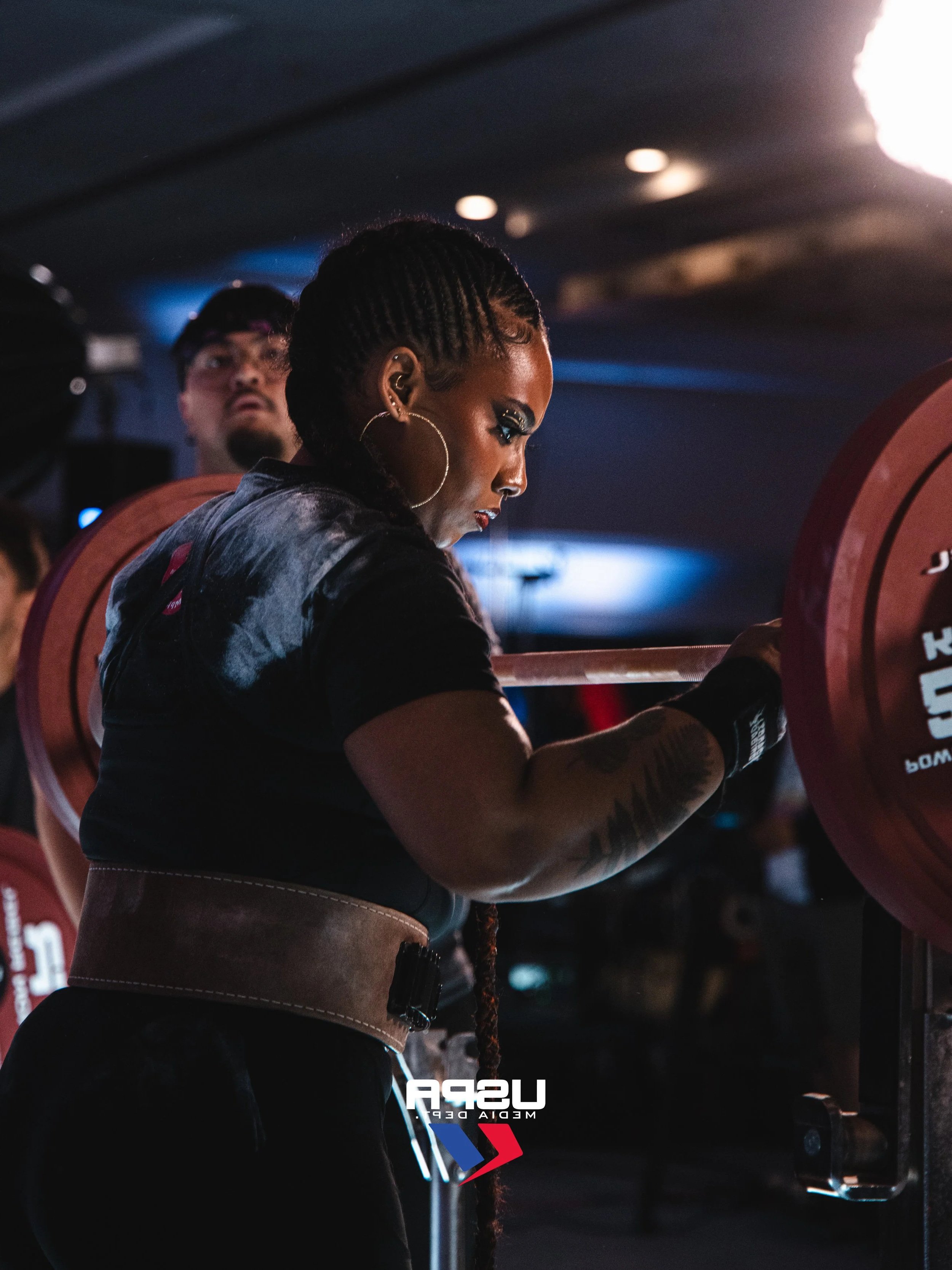 Uplift Grant recipient is setting her hands on the bar before a squat attempt at ULTRA Nationals 2026.