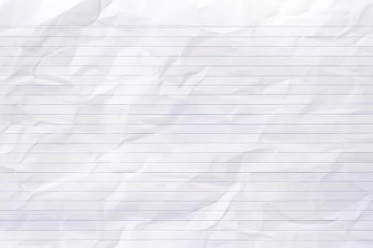 A crumpled sheet of lined notebook paper.