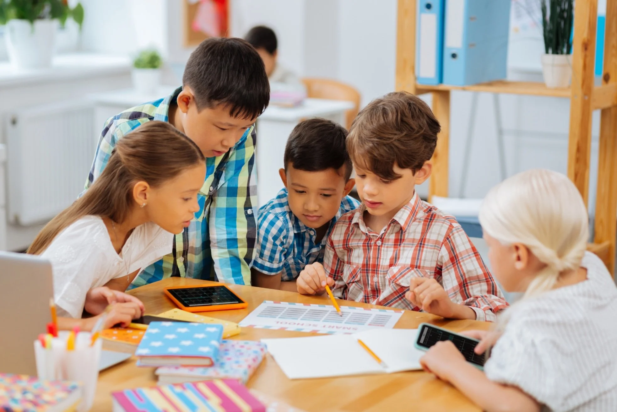 four children working together on a school project