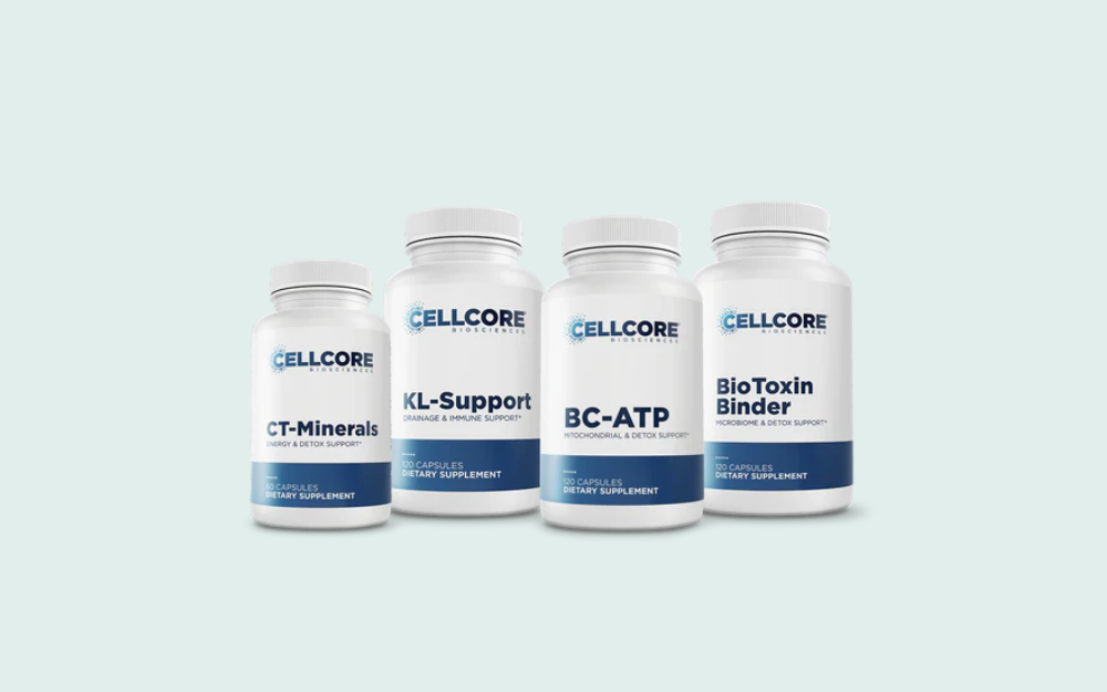 Four bottles of dietary supplements from CellCore, labeled CT-Minerals, KL-Support, BC-ATP, and BioToxin Binder, arranged in a row over a light background.