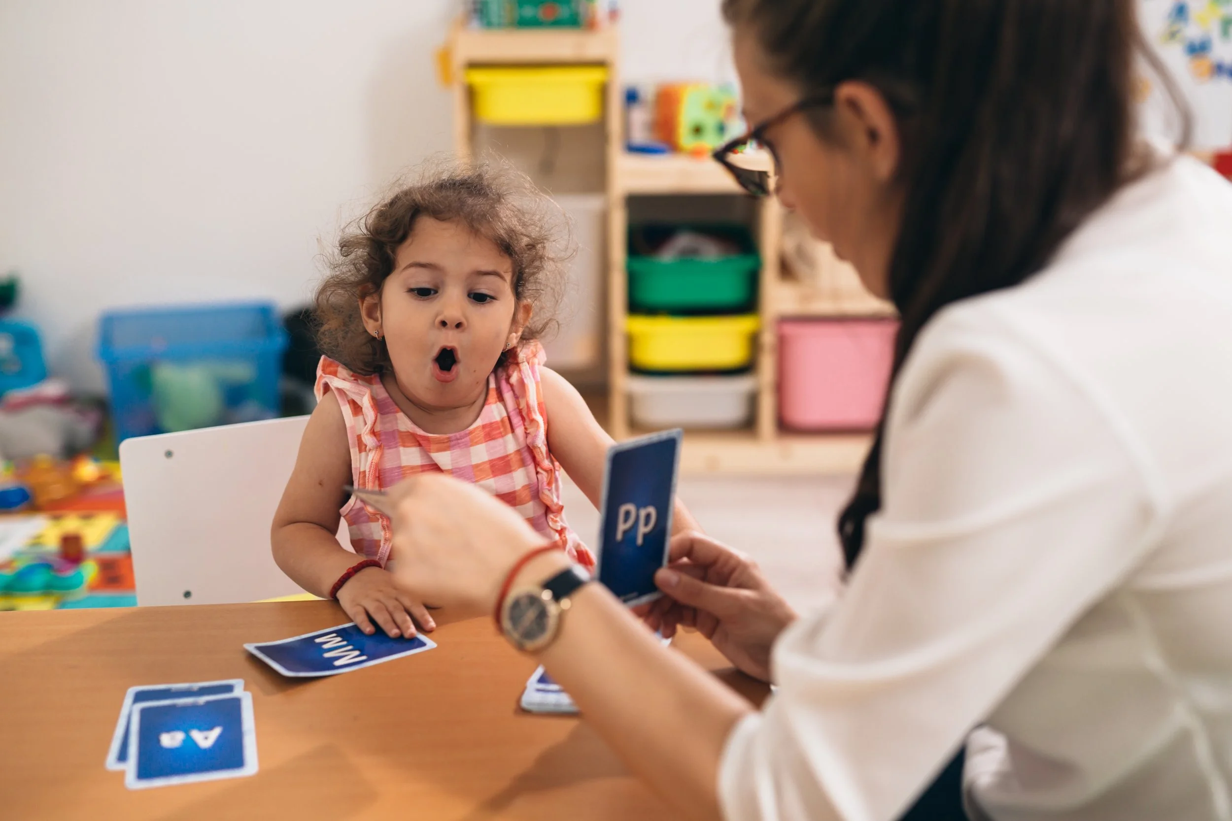 Speech-language pathologist providing pediatric speech therapy to a young child in Broward County