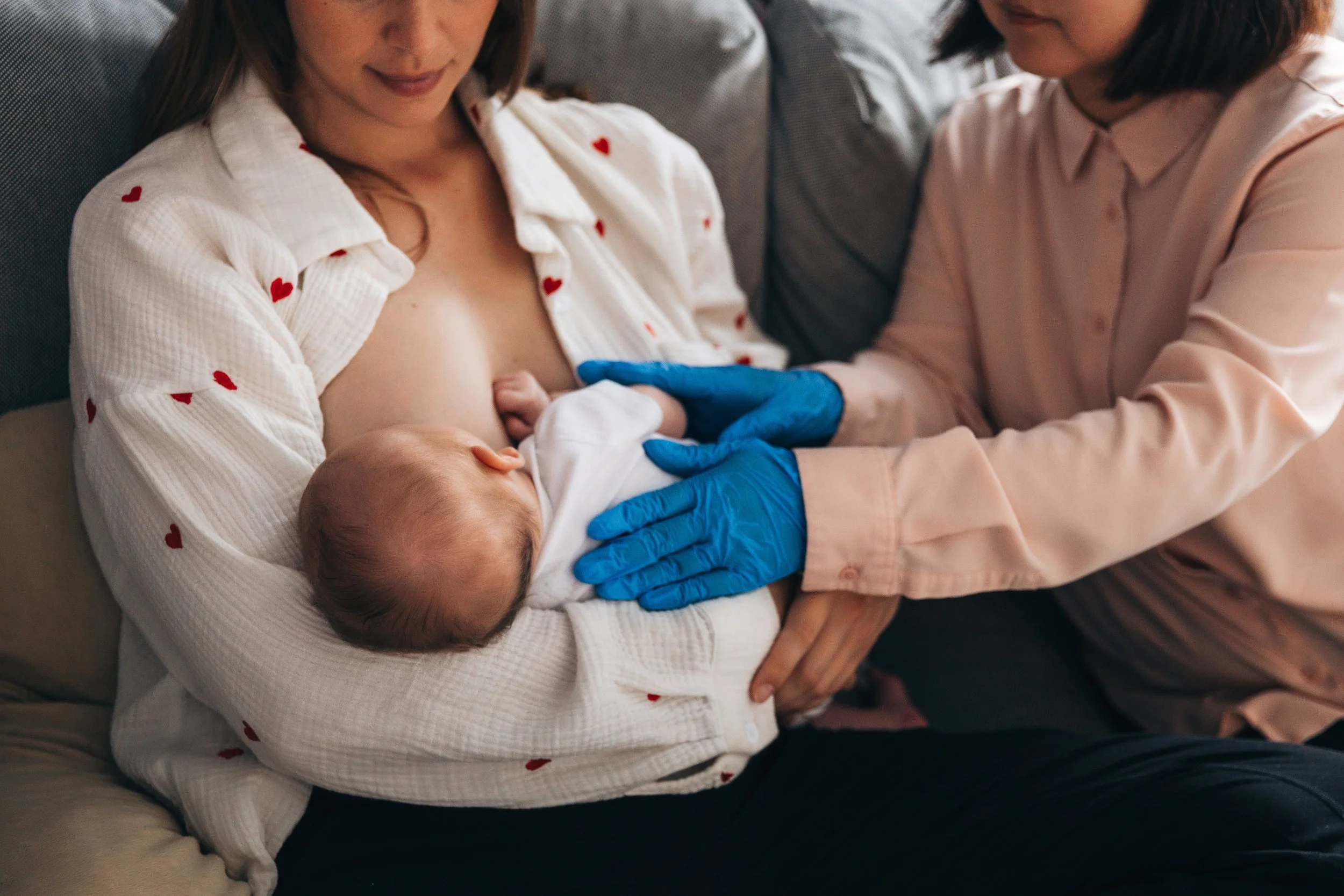 Mother breastfeeding her newborn using a comfortable breastfeeding position