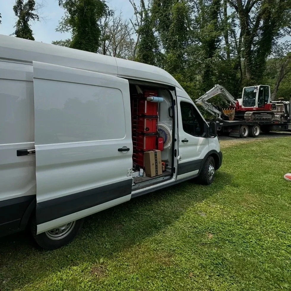 AeroDrop Service Providers work van loaded with HVAC tools on a geothermal job site in the Hudson Valley NY