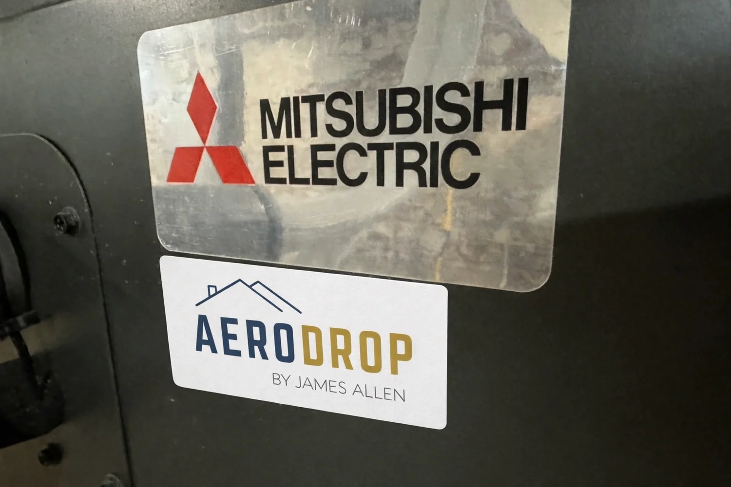 AeroDrop Service Providers and Mitsubishi Electric stickers on installed HVAC equipment in the Hudson Valley NY