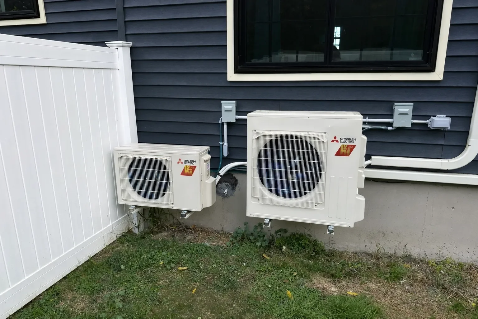 Two Mitsubishi Electric mini-split outdoor condensers installed on a home in Ulster County NY by AeroDrop