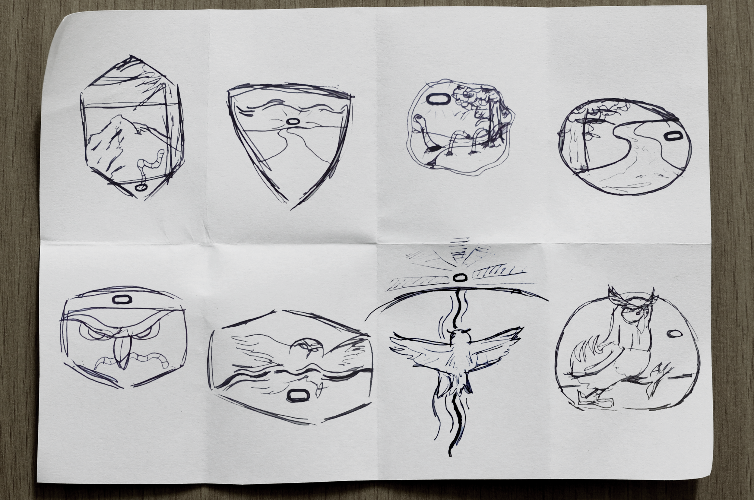 Sketches done on a sheet of paper folded into 8 sections for idea generation.