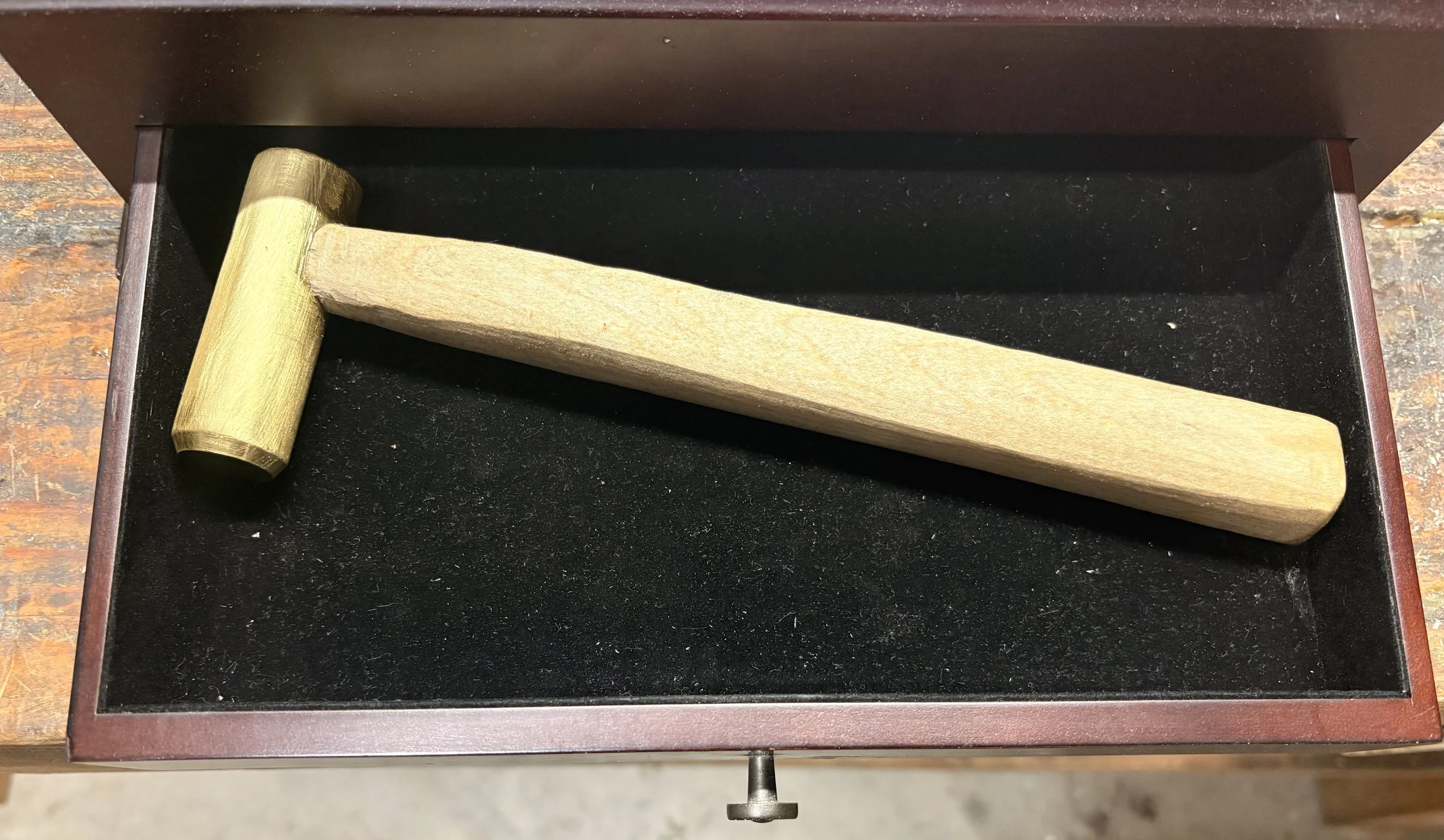 Brass dog head hammer with a hard maple handle