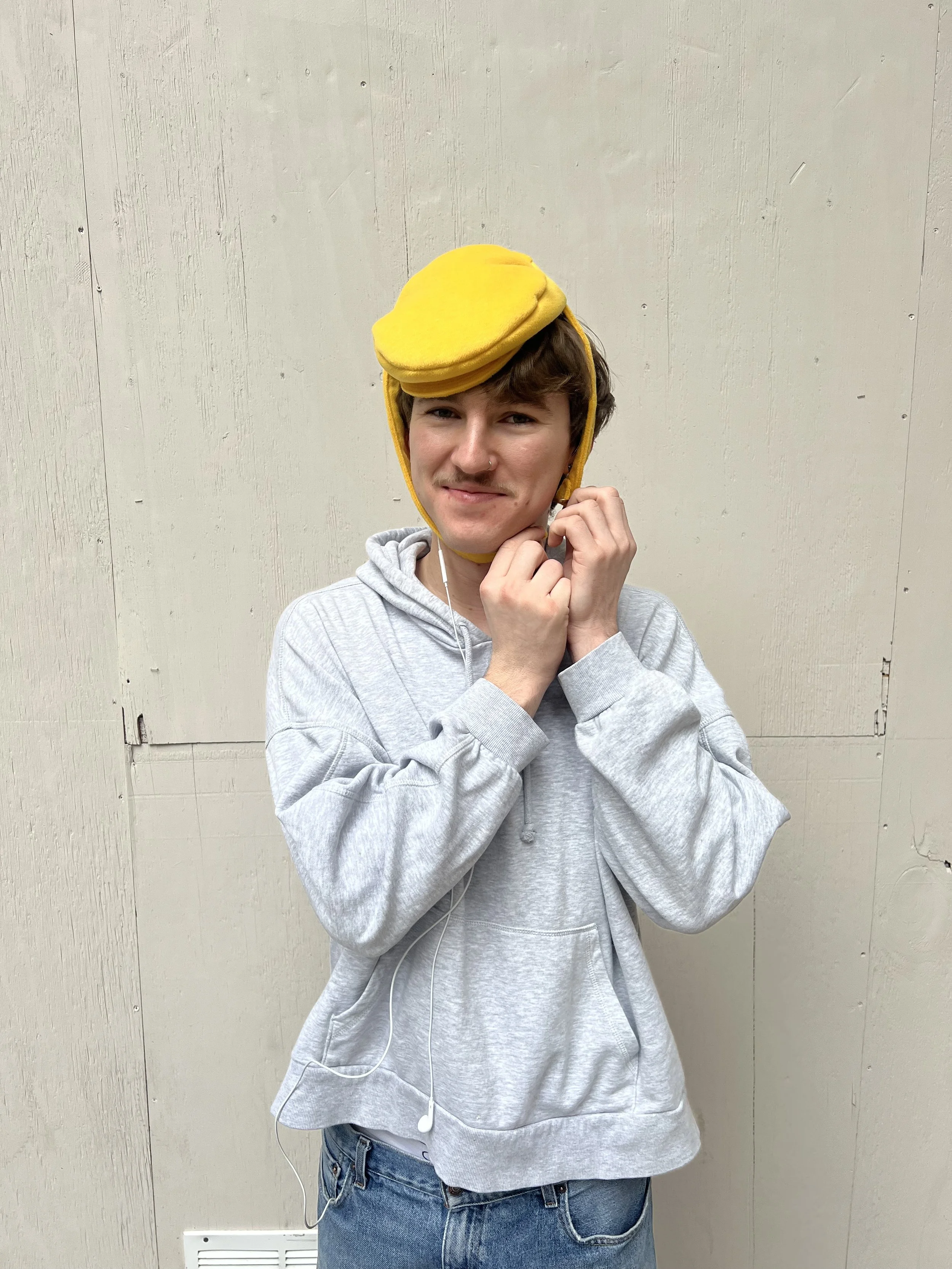 Mini newsboy cap fascinator, in sunshine yellow.