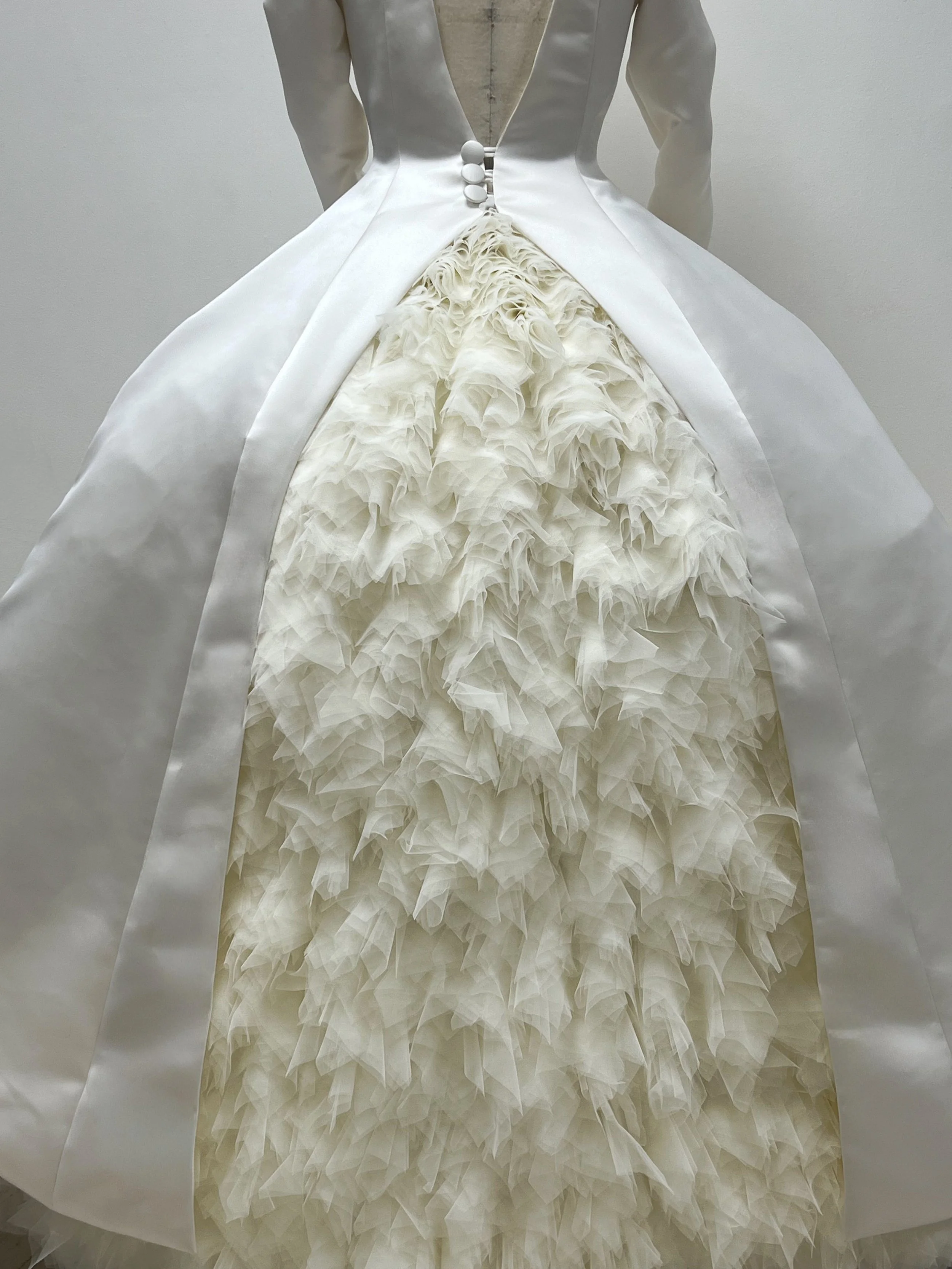 The Skirt - Voluminous, full skirt with petticoat and cage, made of crinoline tulle, Italian mesh tulle, soft tulle and finely woven nylon mesh, and rigilene boning. Double faced satin waistband, large hook and eye at Wearer's left, hand sewn soft tu