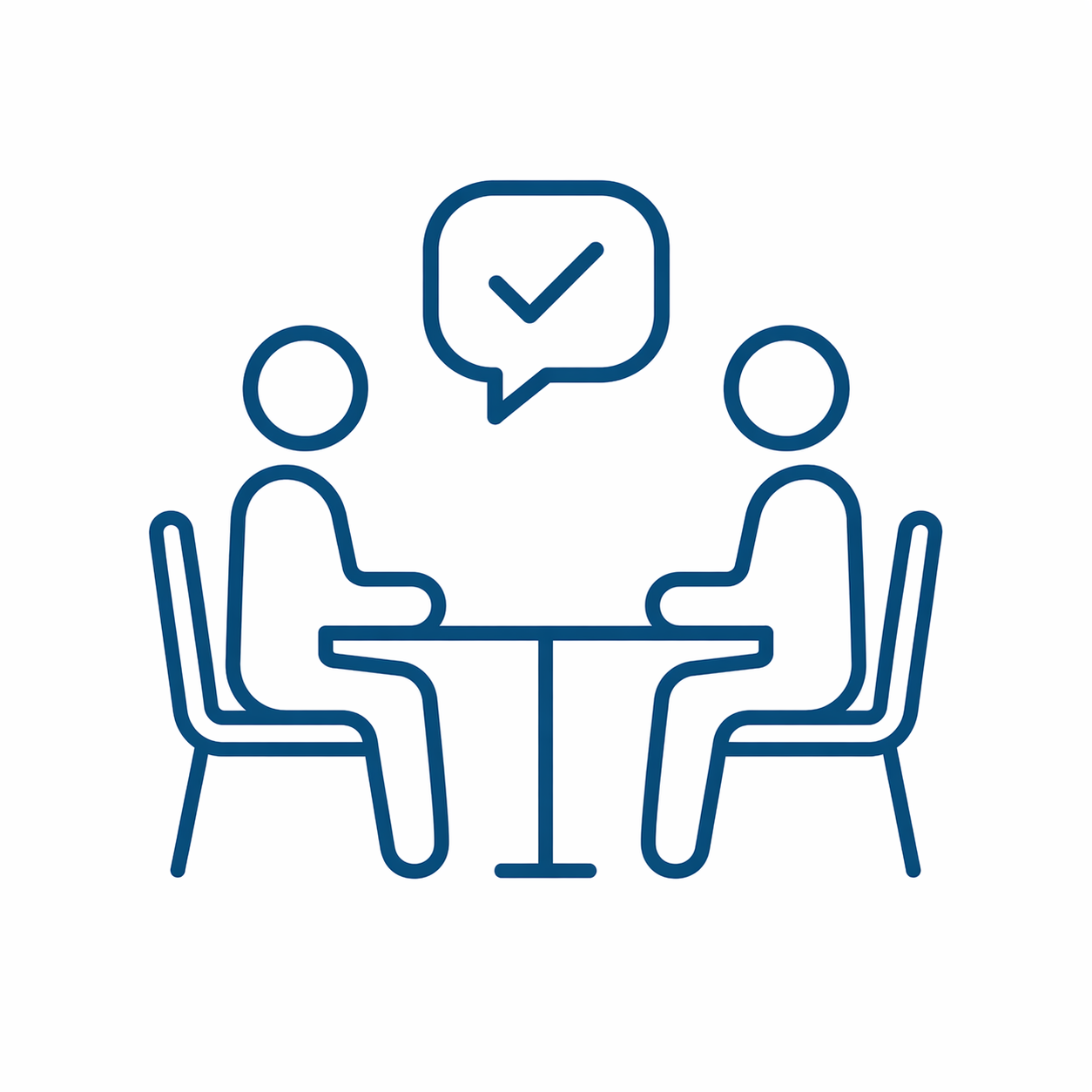 Two people sitting across a table having a conversation. A speech bubble with a checkmark is shown above them.