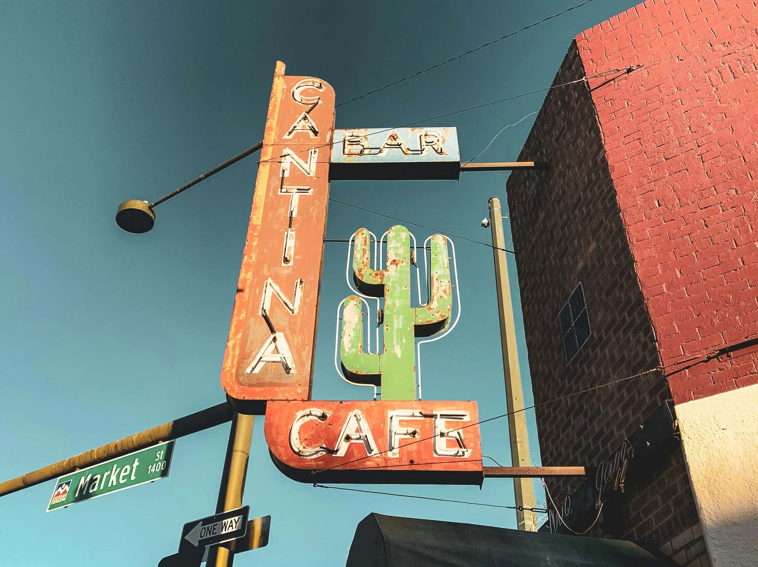 Street view of a restaurant sign that reads 'Cantina Cafe'