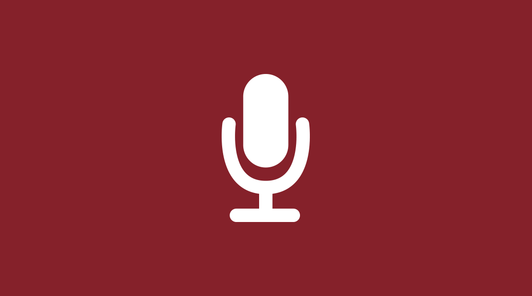 Icon of a microphone on a red background.
